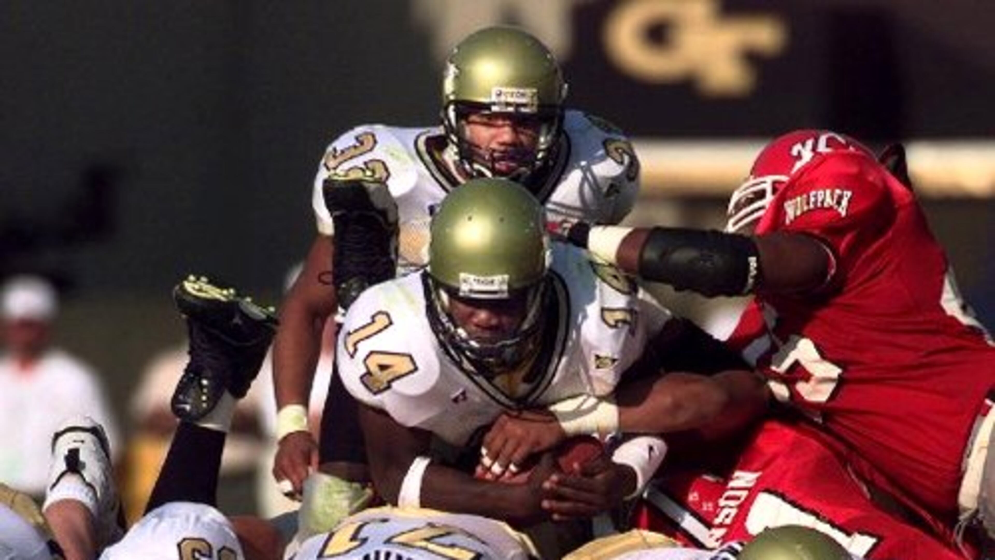 Georgia Tech quarterback Joe Hamilton (14) also rushed for 1,758 yards at Tech, another school record. In 1999, he ran for 734 yards, setting another mark.