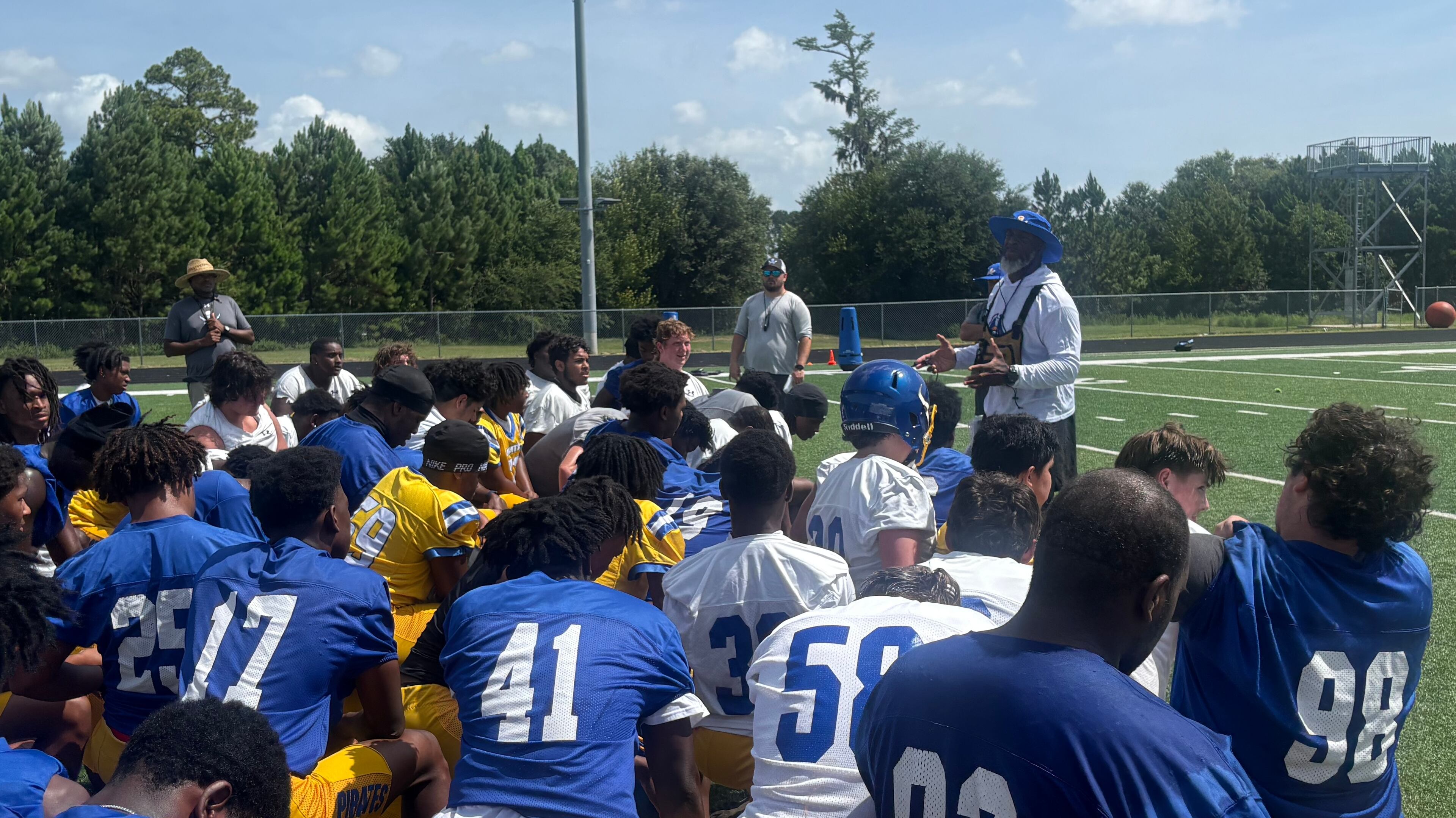 Brunswick football enters a new era under former Cook coach Byron Slack (center right, back). The Pirates are trying to move forward from a season-ending fight in the second round of the 2025 playoffs that led to more than 40 suspensions and a 2026 playoff ban. Most of the suspensions and the ban were later repealed. (Jack Leo/AJC)