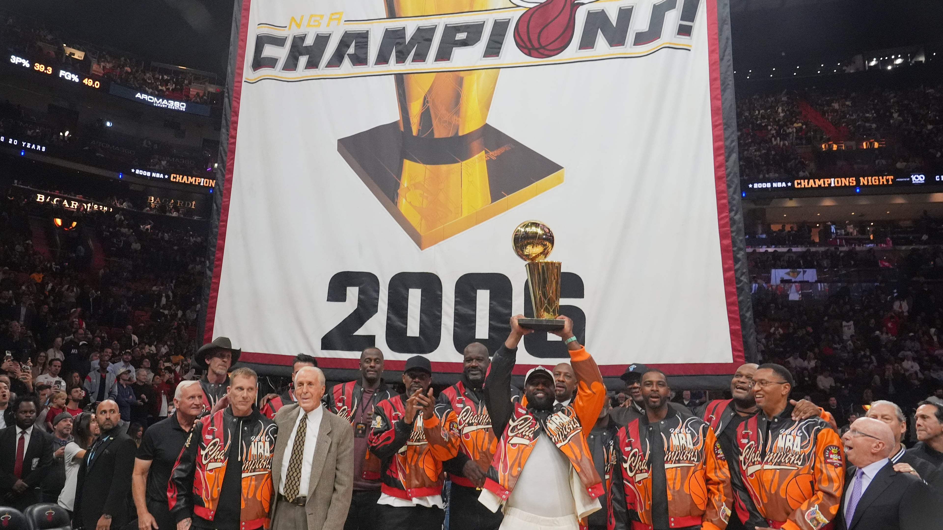 The Miami Heat 2006 NBA championship team pose with the trophy during a half time celebration Tuesday, Feb. 3, 2026, in Miami. (AP Photo/Marta Lavandier)