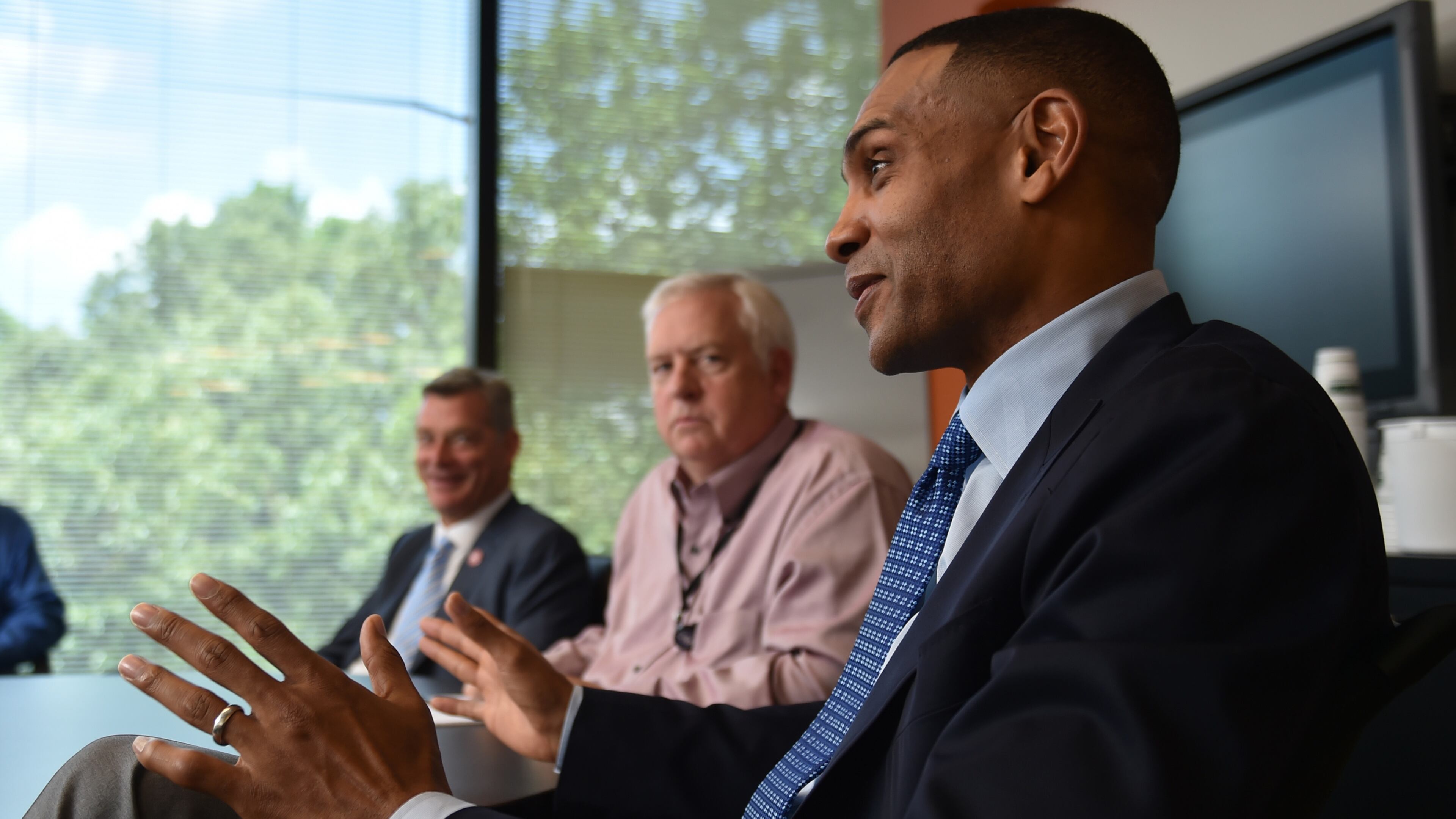 The Atlanta Hawks new principal owner Tony Ressler and partner Grant Hill, foreground, met with Atlanta Journal Constitution editors, managers and reporters Thursday June 25, 2015. AJC file photo
