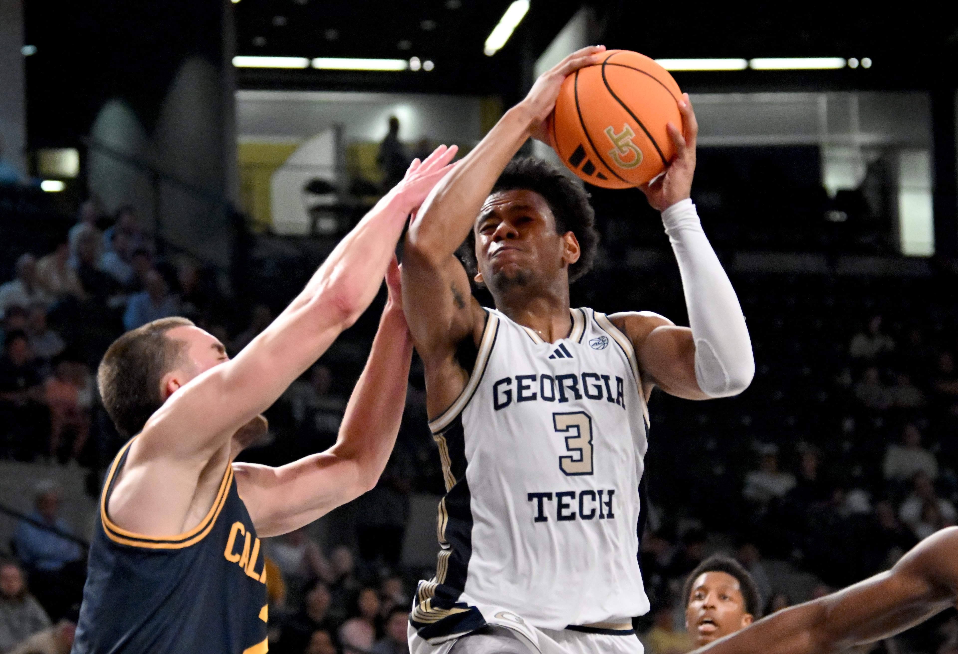 Georgia Tech guard Jaeden Mustaf (3) drives against California forward John Camden (2) during the second half of an NCAA college basketball game at Georgia Tech’s McCamish Pavilion, Wednesday, March 4, 2026, in Atlanta. California won 76-65 over Georgia Tech. (Hyosub Shin/AJC)