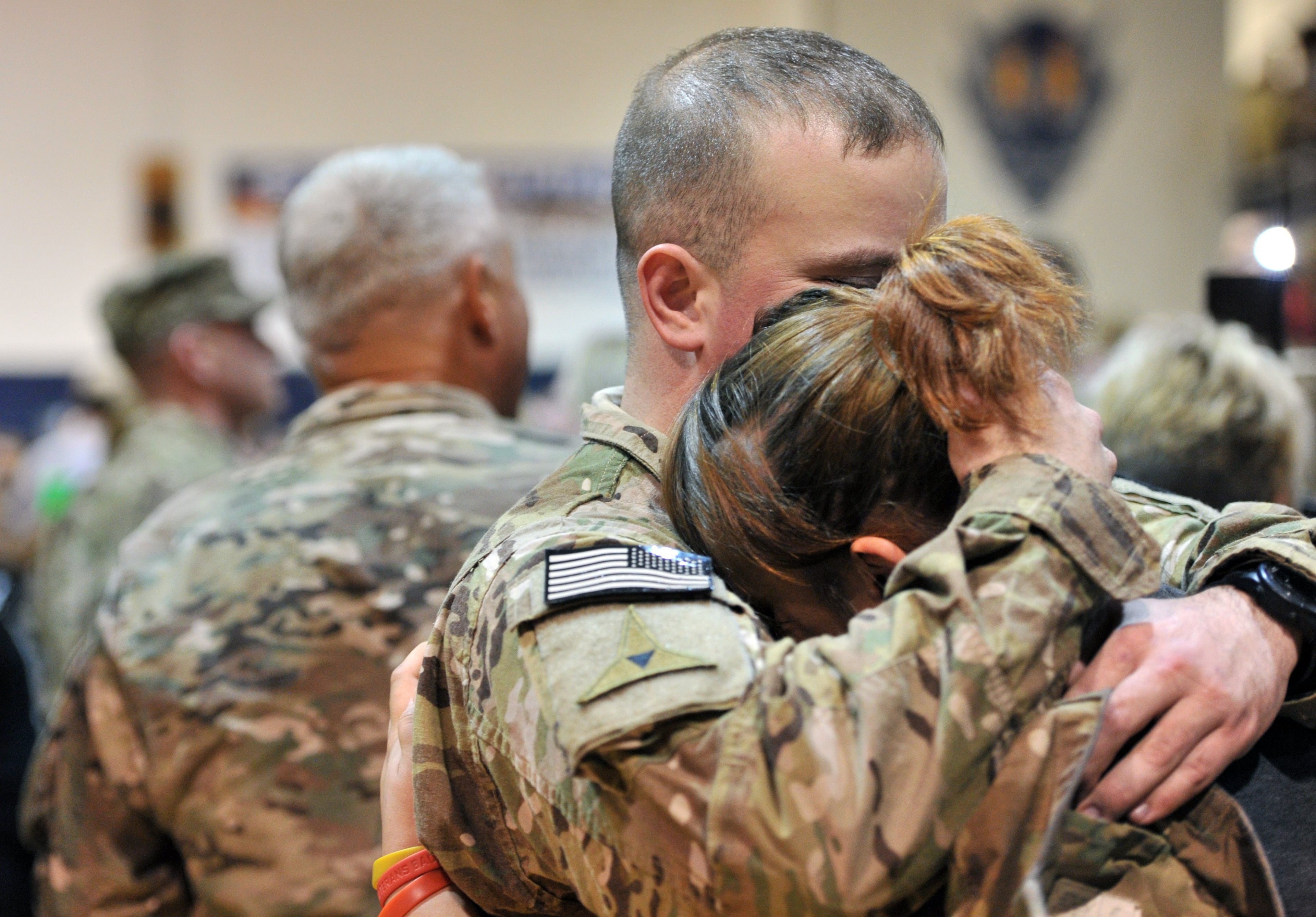 Soldiers are welcome by their family members after nearly a year deployment in Afghanistan during welcoming home ceremony at Elbert County gym in Elberton on Saturday, Jan. 11, 2014. Georgia Army National Guard's own 648th Maneuver Enhancement Brigade is welcoming home on Saturday over 200 Guardsmen with the 1-214th Field Artillery Battalion from nearly a year in Afghanistan where they conducted base defense operations in Western Afghanistan.