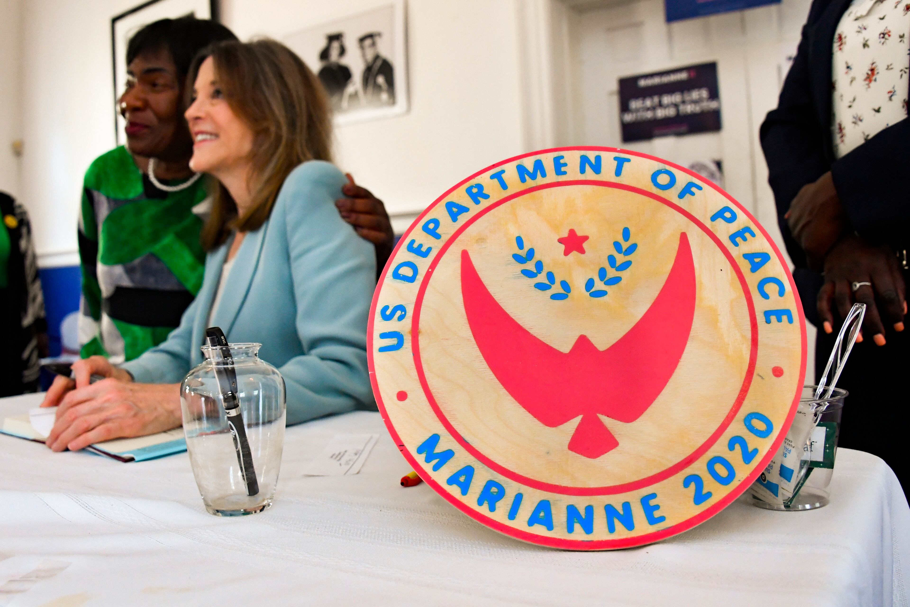 Democratic presidential candidate Marianne Williamson poses with an attendee during a book signing after delivering the sermon at Hillside International Truth Center in Atlanta on Sunday, September 1, 2019. As president, Williamson wants to establish a U.S. Department of Peace.