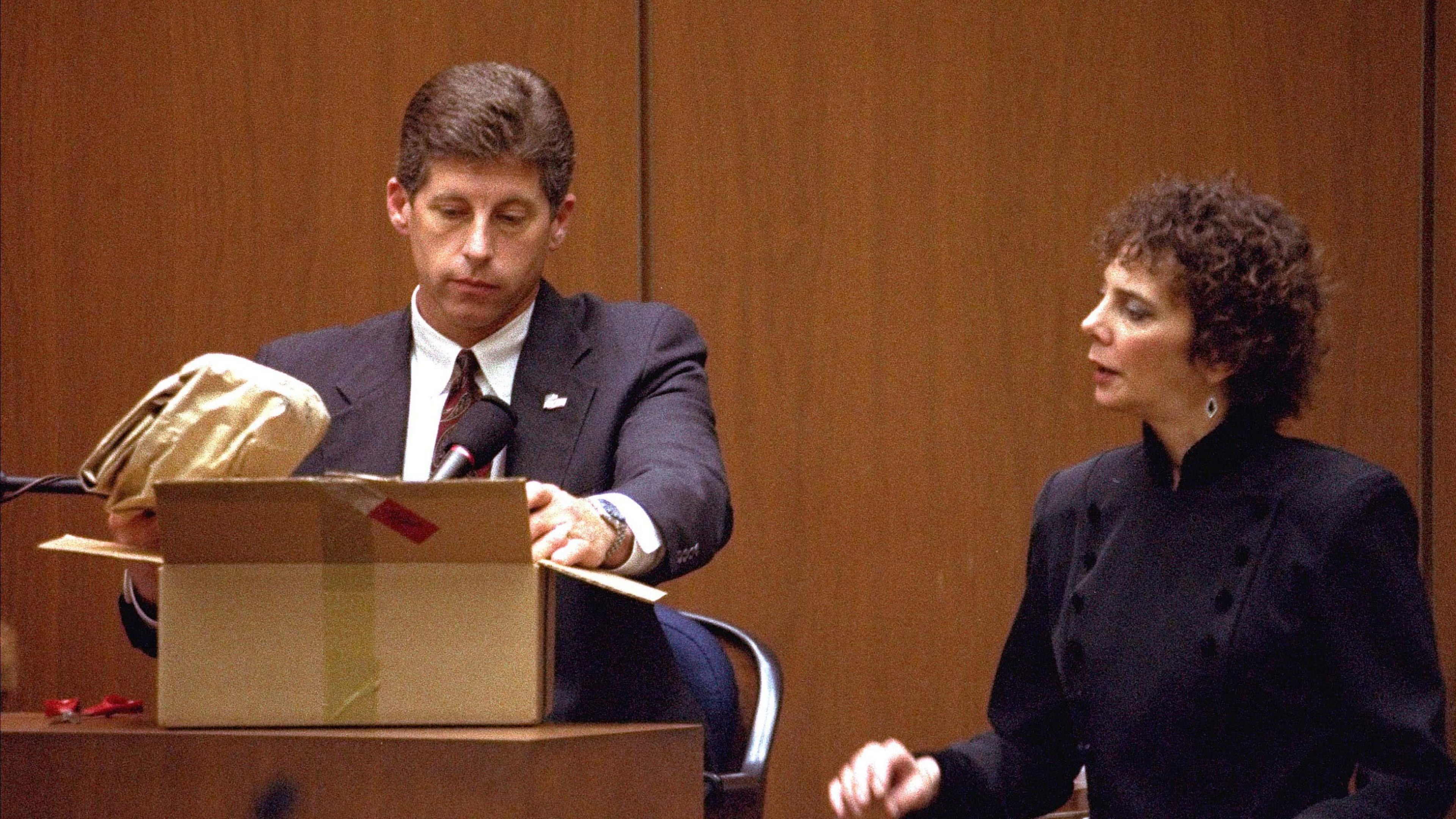 FILE - Los Angeles Police Detective Mark Fuhrman shows the jury in the O.J. Simpson double murder trial evidence during testimony Friday, March 10, 1995, in Los Angeles. (AP Photo/Nick Ut, Pool, File)