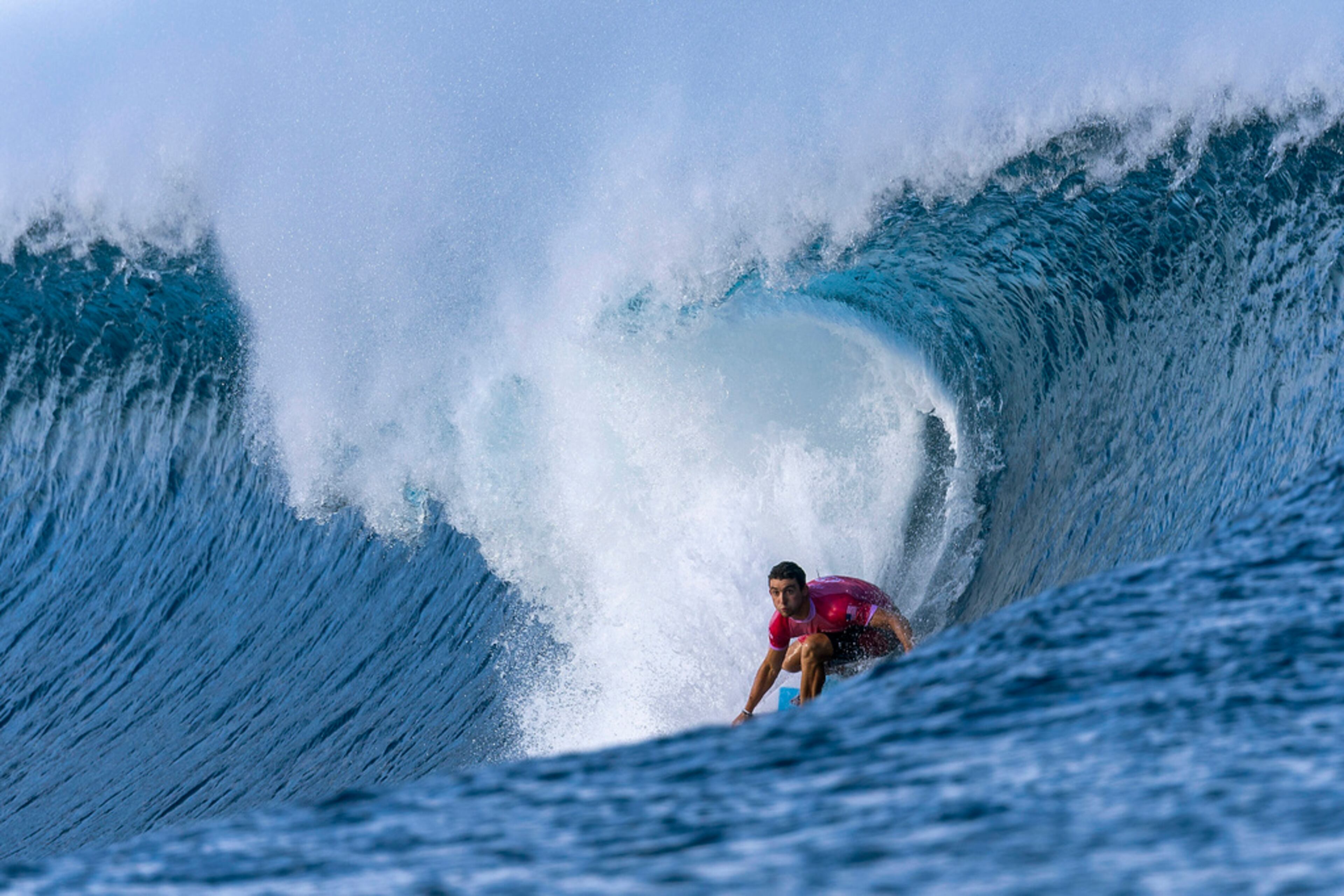 Griffin Colapinto of the United State rides a wave, during round three of the surfing competition, on day three at the 2024 Summer Olympics, Monday, July 29, 2024, in Teahupo'o, French Polynesia. (Ed Sloane/Pool Photo via AP)