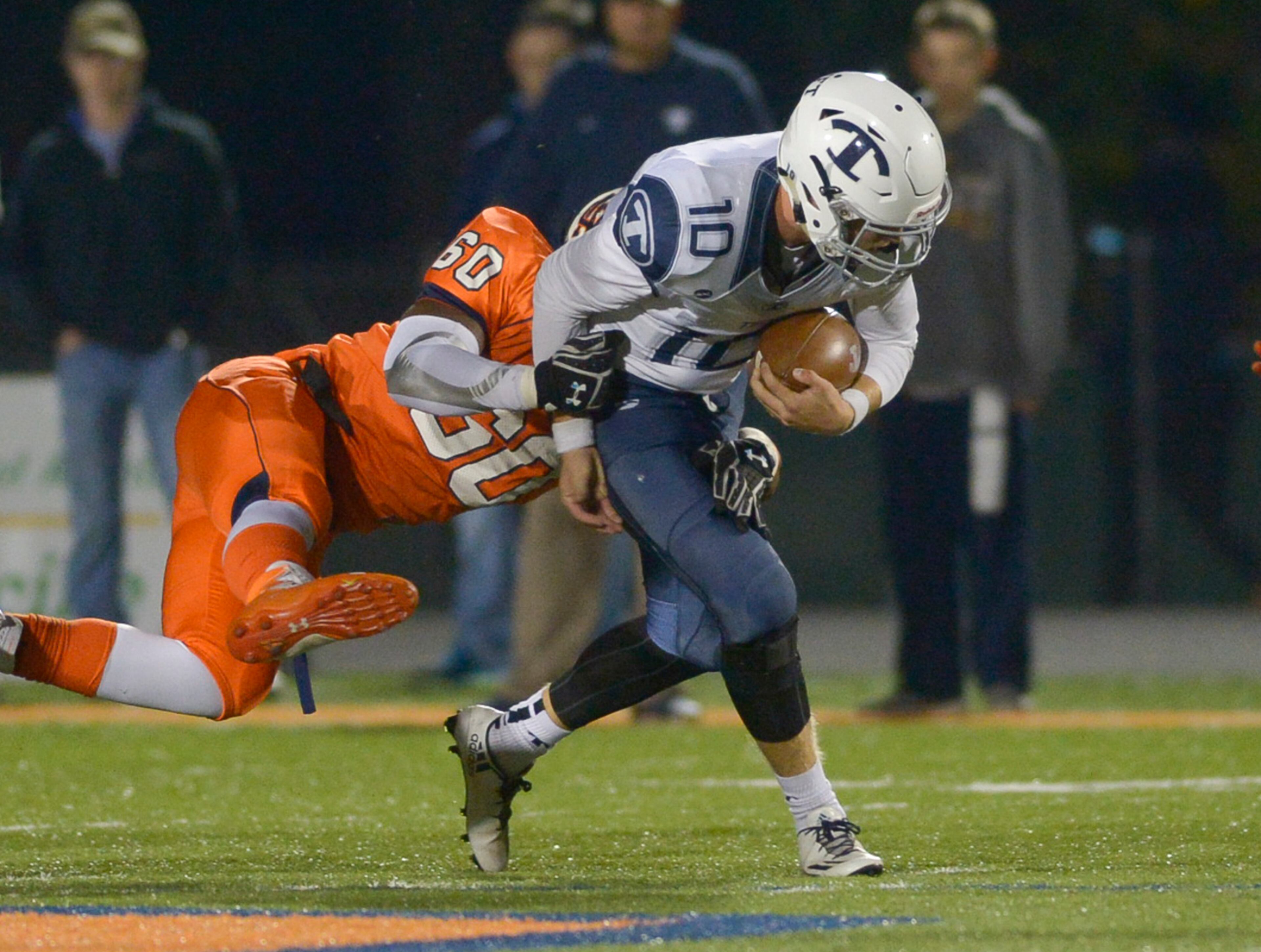 Kennesaw, Ga. -- North Cobb sophomore OL Michael Dixon (60) tackles Tift County sophomore QB Griffin Collier (10) in the first half of their football game at North Cobb Friday November 11, 2016. SPECIAL/Daniel Varnado