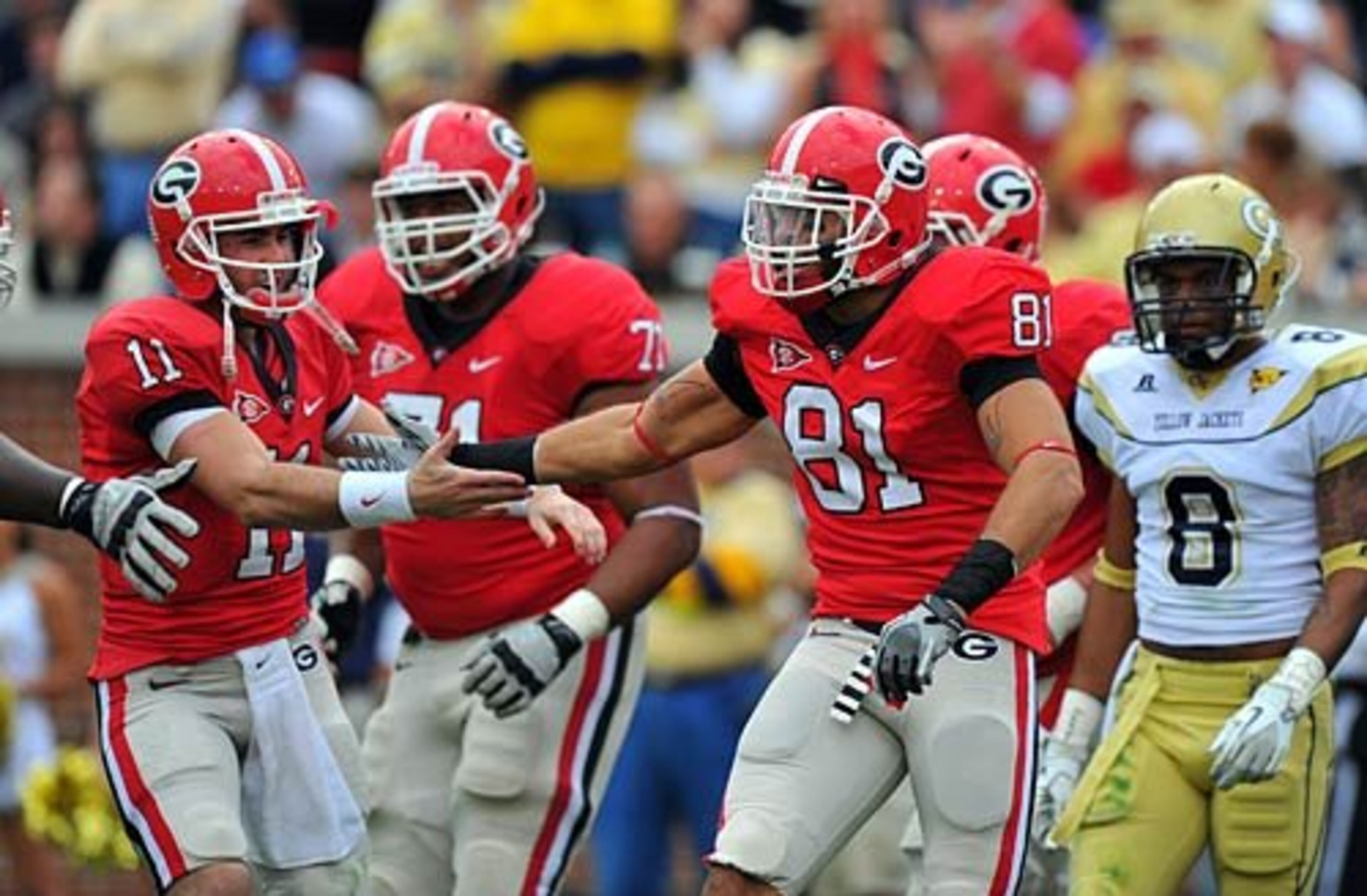 Georgia quarterback Aaron Murray, left, celebrates with Aron White (81) after the two connected for a touchdown against Georgia Tech.