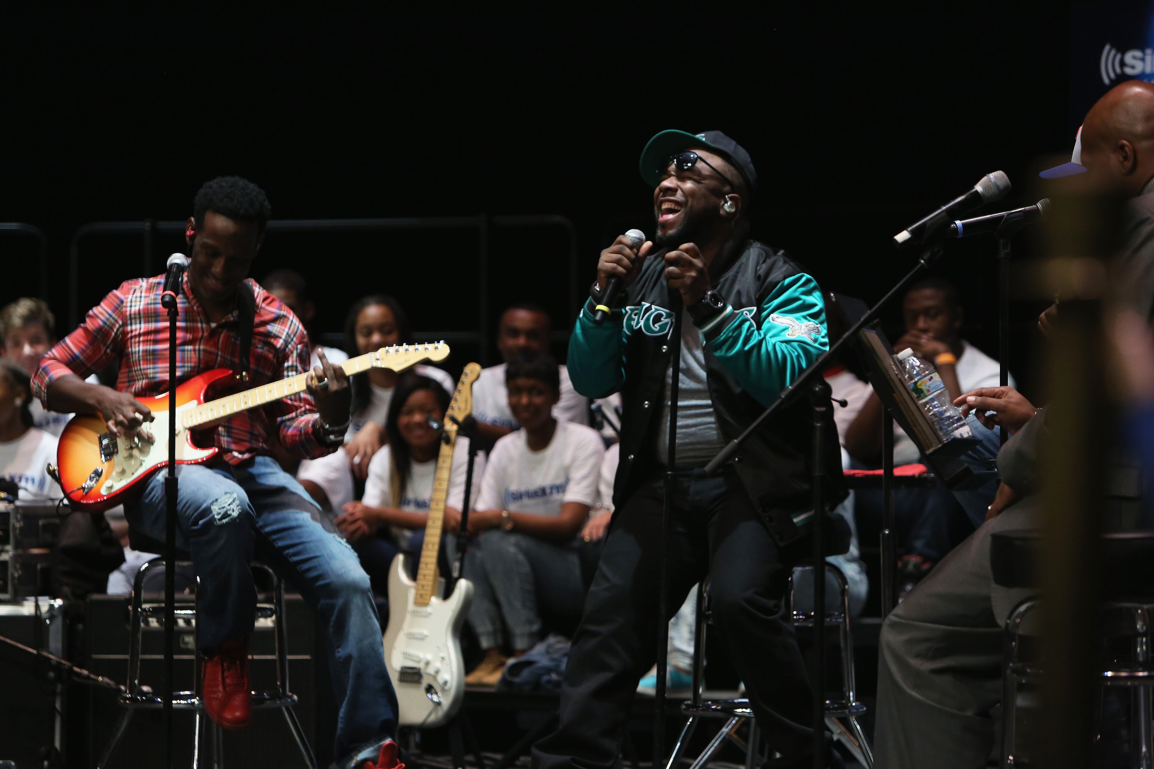PHILADELPHIA, PA - OCTOBER 14: (L-R) Shawn Stockman and Wanya Morris of Boyz II Men perform during SiriusXM's "Up Close & Personal with Boyz II Men" at The Philadelphia High School for the Creative & Performing Arts October 14, 2014 in Philadelphia, Pennsylvania. (Photo by Bill McCay/Getty Images for SiriusXM)