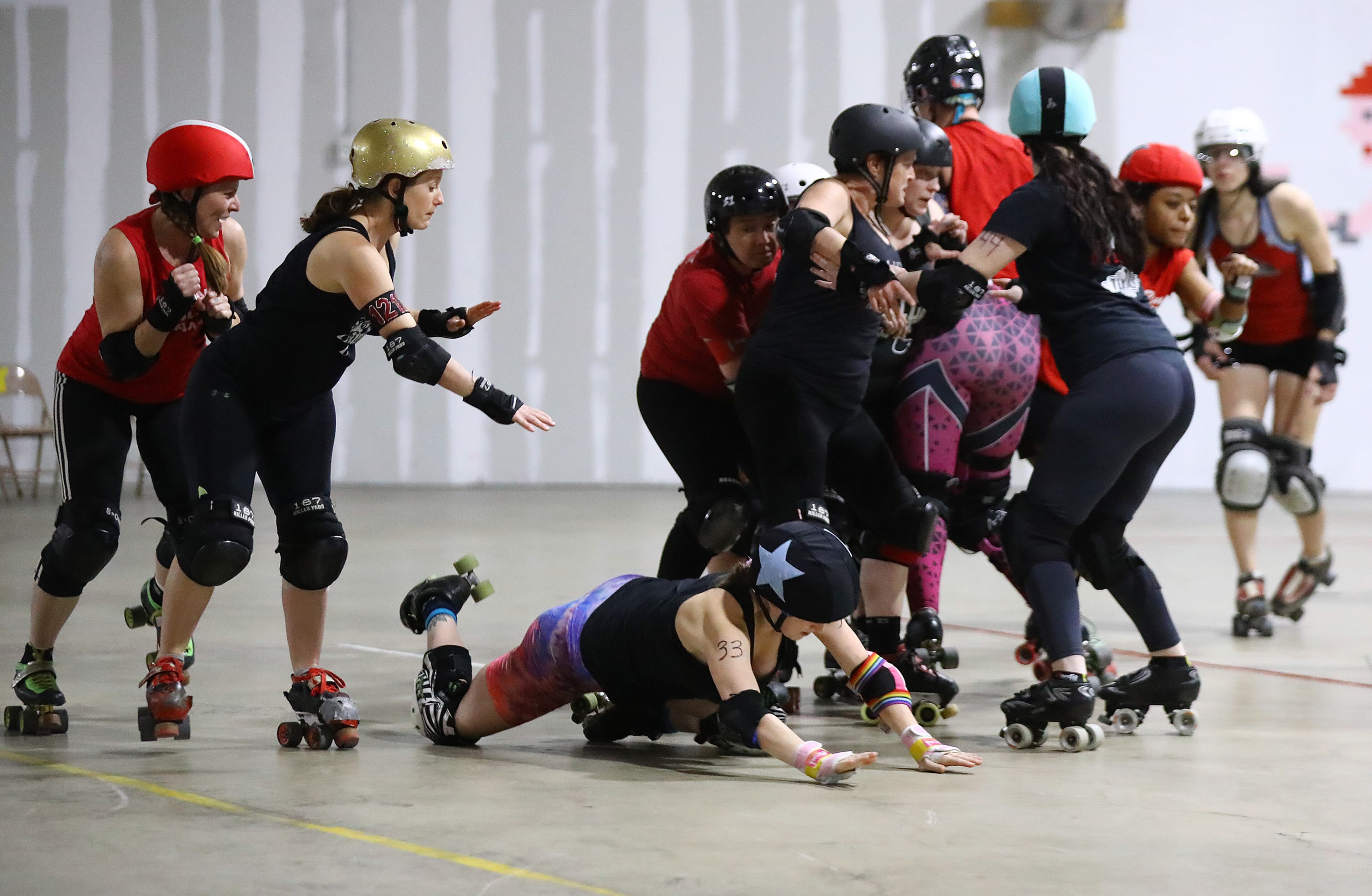 033022 Mableton: Atlanta Roller Derby team members get physical while mixing it up during practice at their training facility on Wednesday, March 30, 2022, in Mableton. “Curtis Compton / Curtis.Compton@ajc.com”