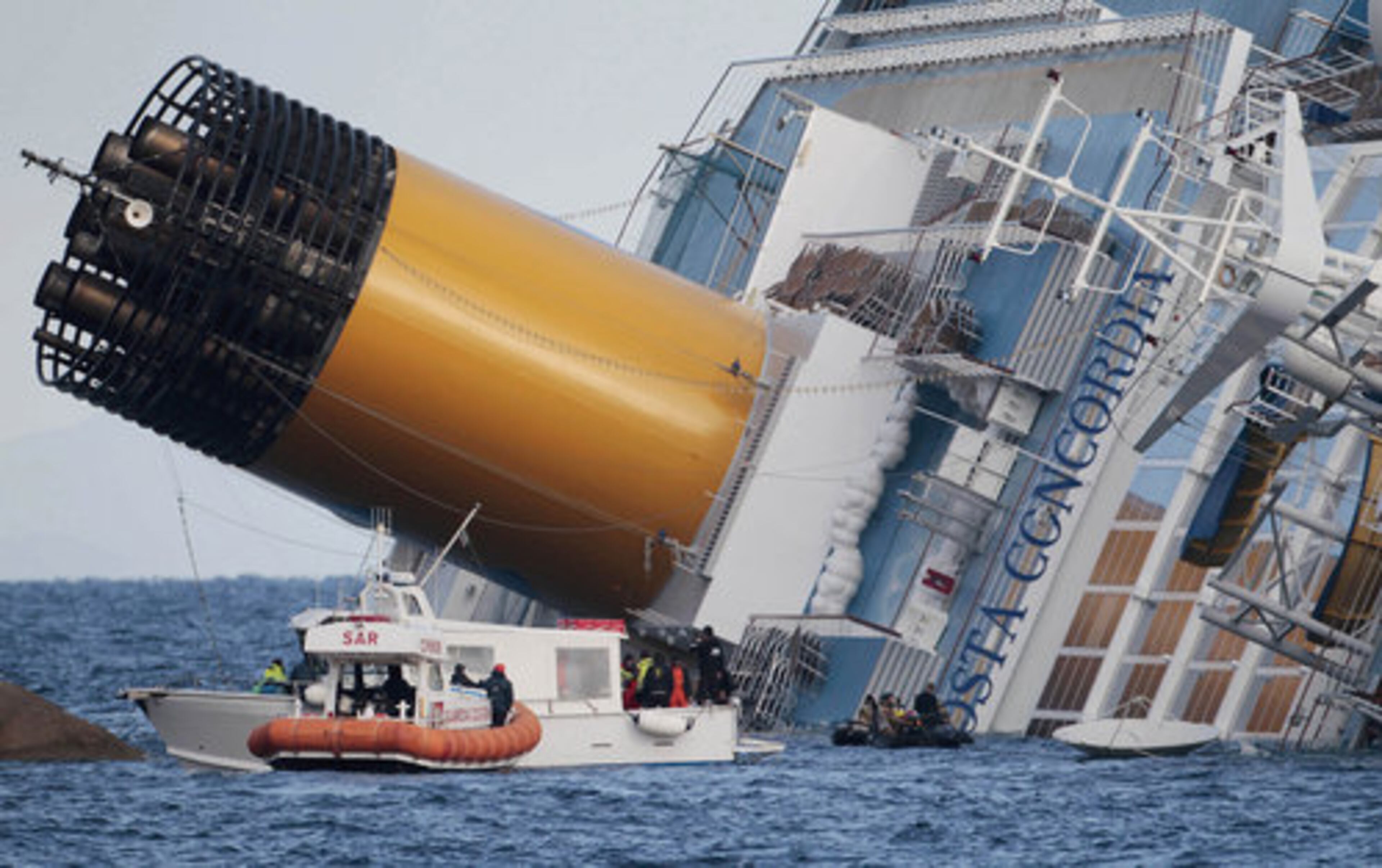 Italian firefighters conduct search operations on the luxury cruise ship Costa Concordia.