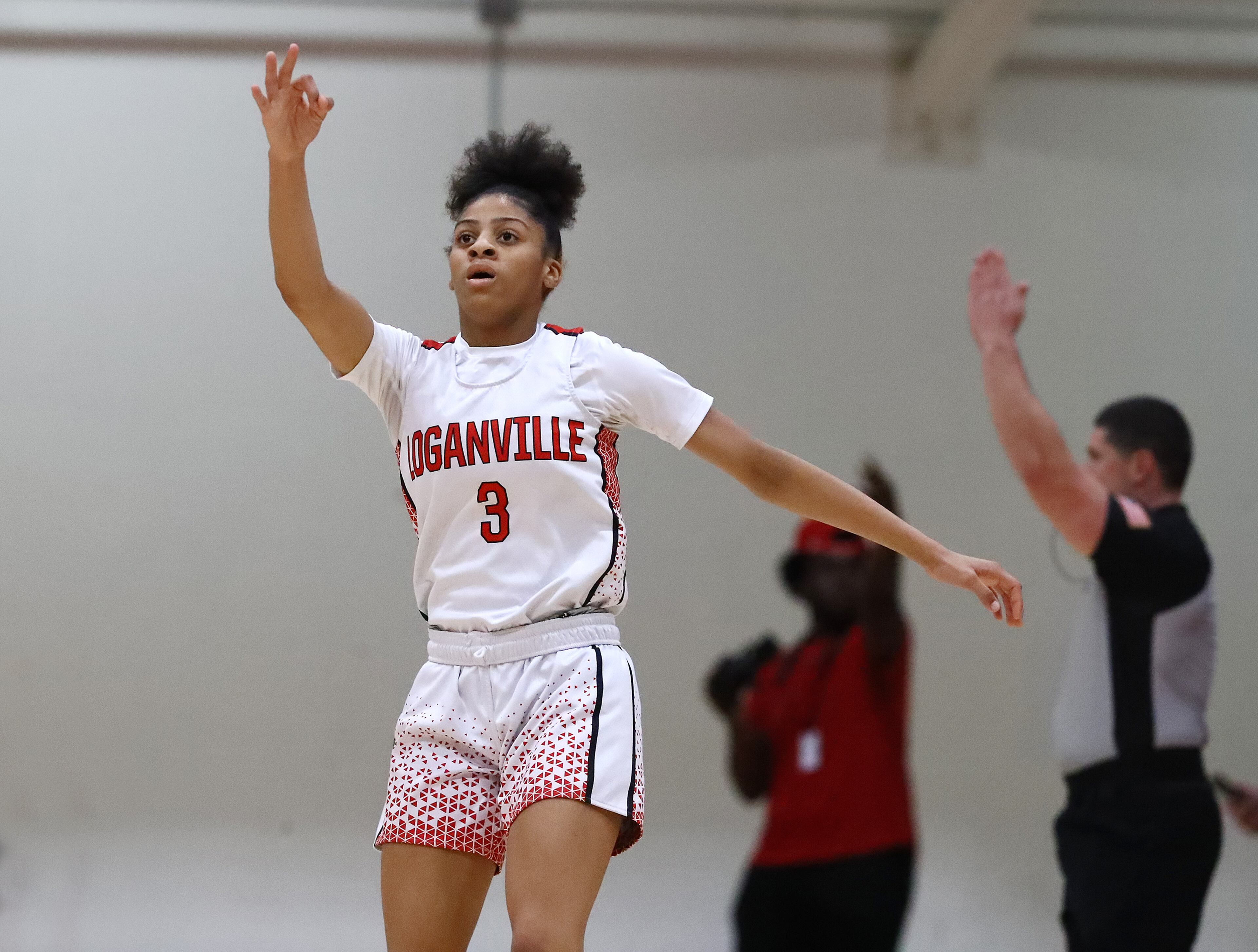 Loganville guard Sydney Bolden reacts to hitting a three-pointer against Forest Park in their high school basketball tournament game on Wednesday, March 2, 2022, in Loganville. “Curtis Compton / Curtis.Compton@ajc.com”`
