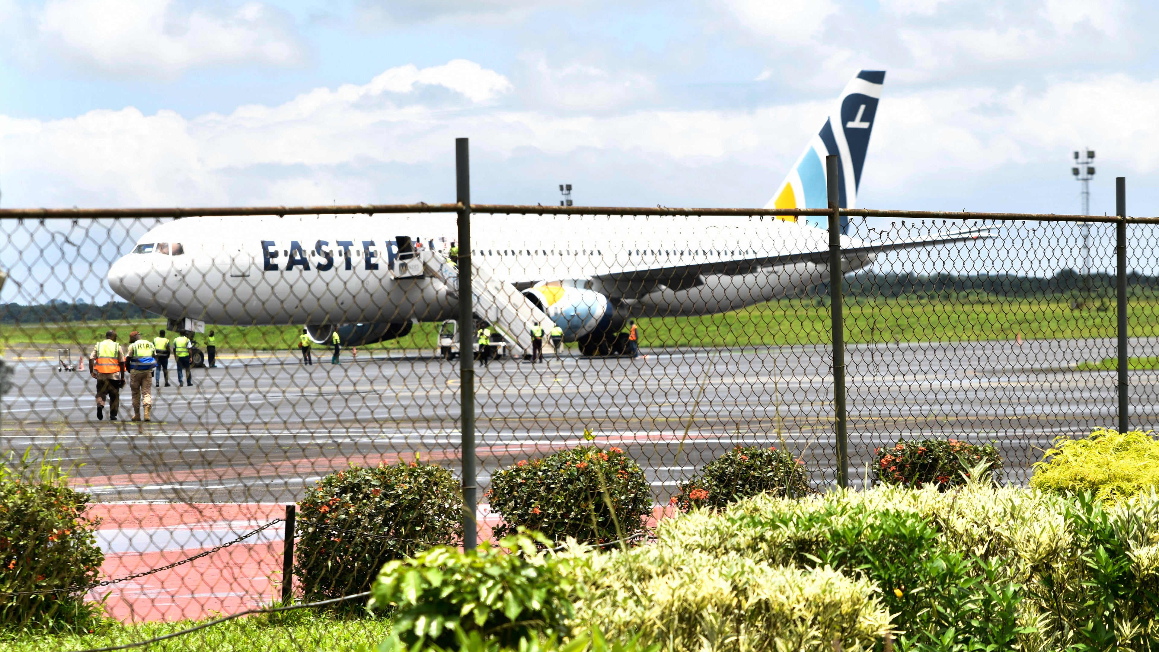 A plane carrying the deportees from the United States arrives at the Roberts International Airport outside of Monrovia, Liberia, Thursday, Aug. 20, 2026. (AP Photo/Alexander Wiaplah)