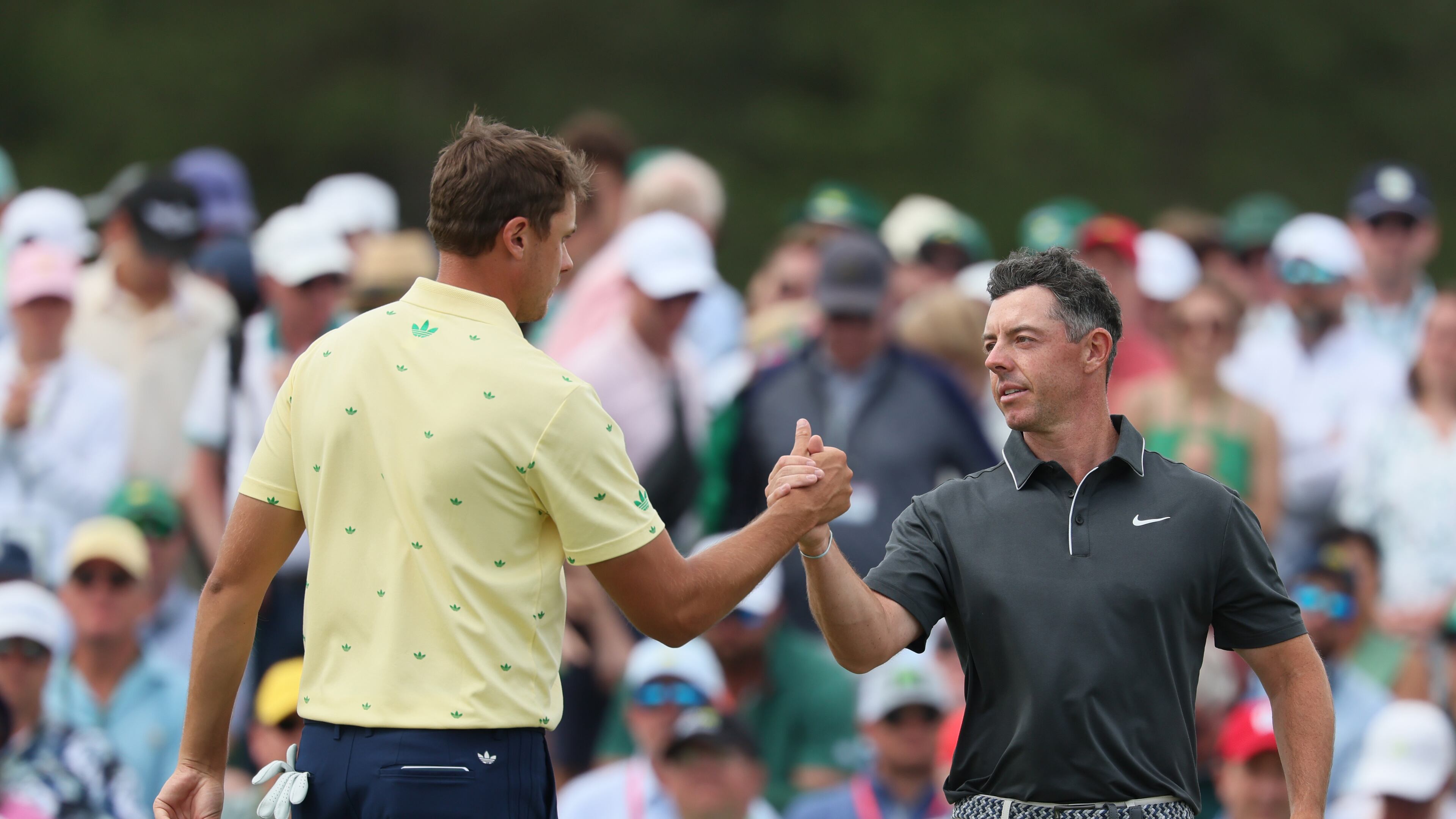 Rory McIlroy, right, greets Ludvig Åberg at the end of their second round of the Masters golf tournament, at Augusta National Golf Club, Friday, April 11, 2025, in Augusta, Ga. (Jason Getz / AJC)