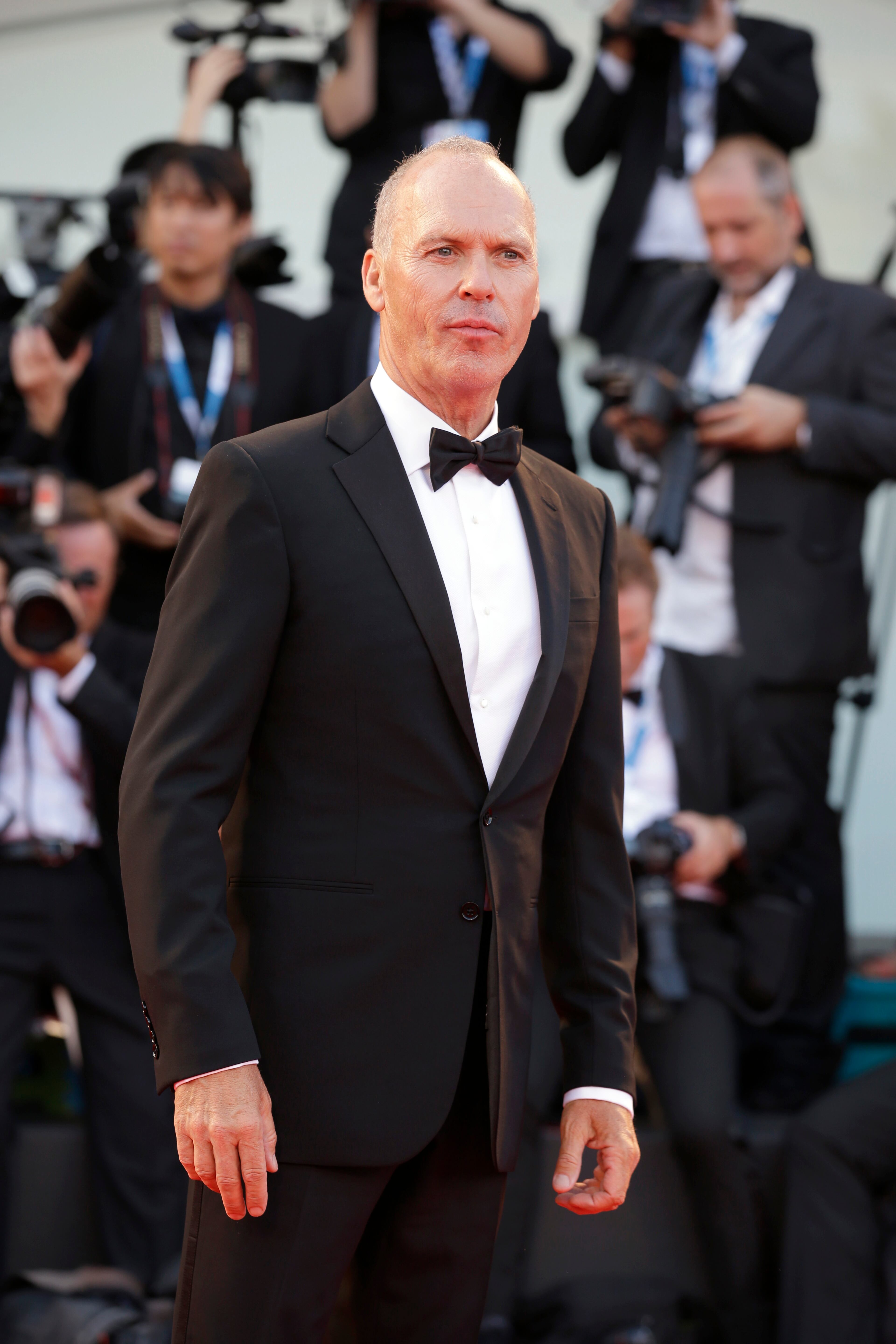 Michael Keaton arrives for the screening of the movie Birdman opening the 71st edition of the Venice Film Festival in Venice, Italy, Wednesday, Aug. 27, 2014. (AP Photo/Andrew Medichini)