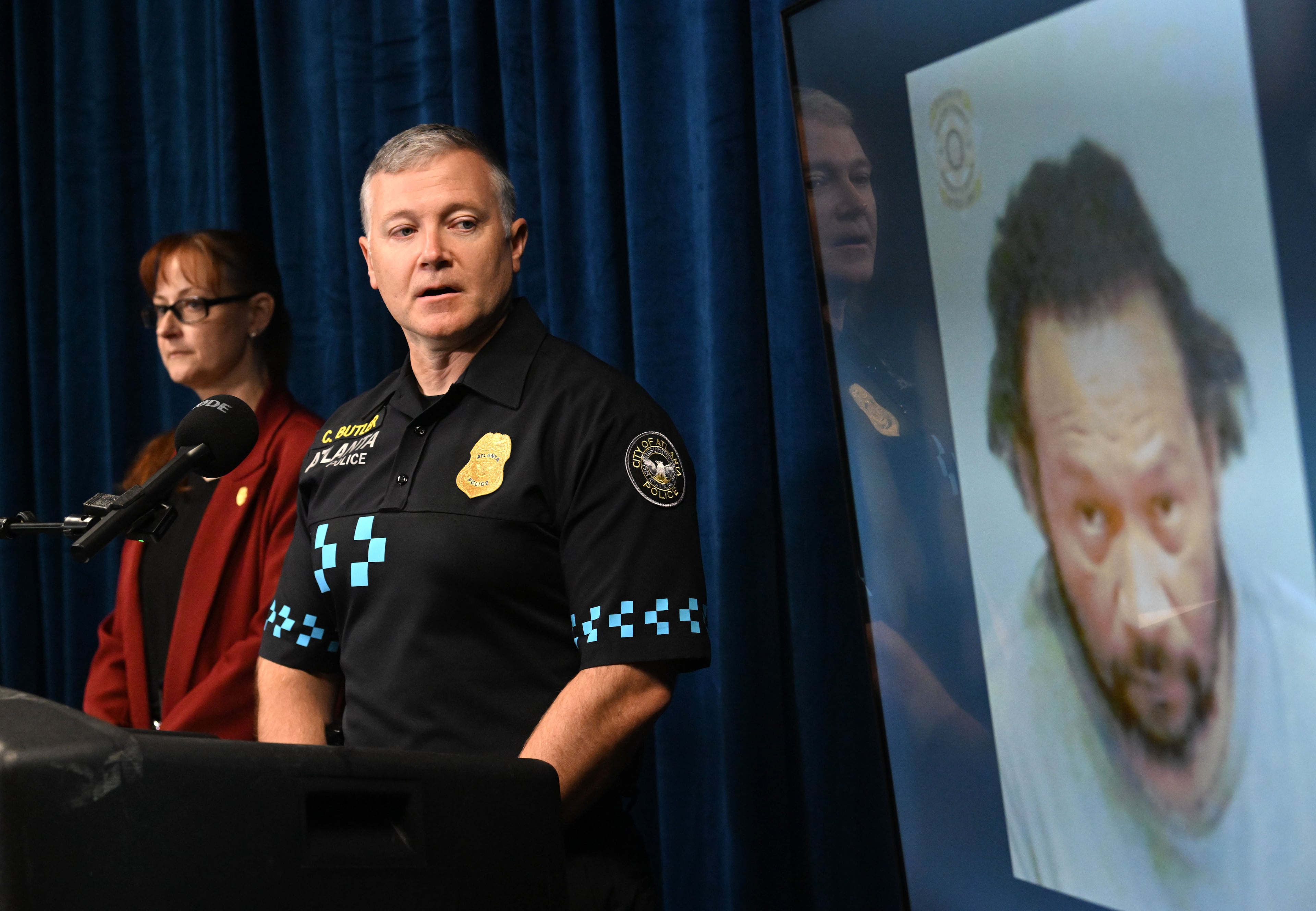 Lt. Christapher Butler and detective Summer Benton discuss details of the 1999 cold case after arresting and charging Janarra Sherrer with murder. (Hyosub Shin/AJC)