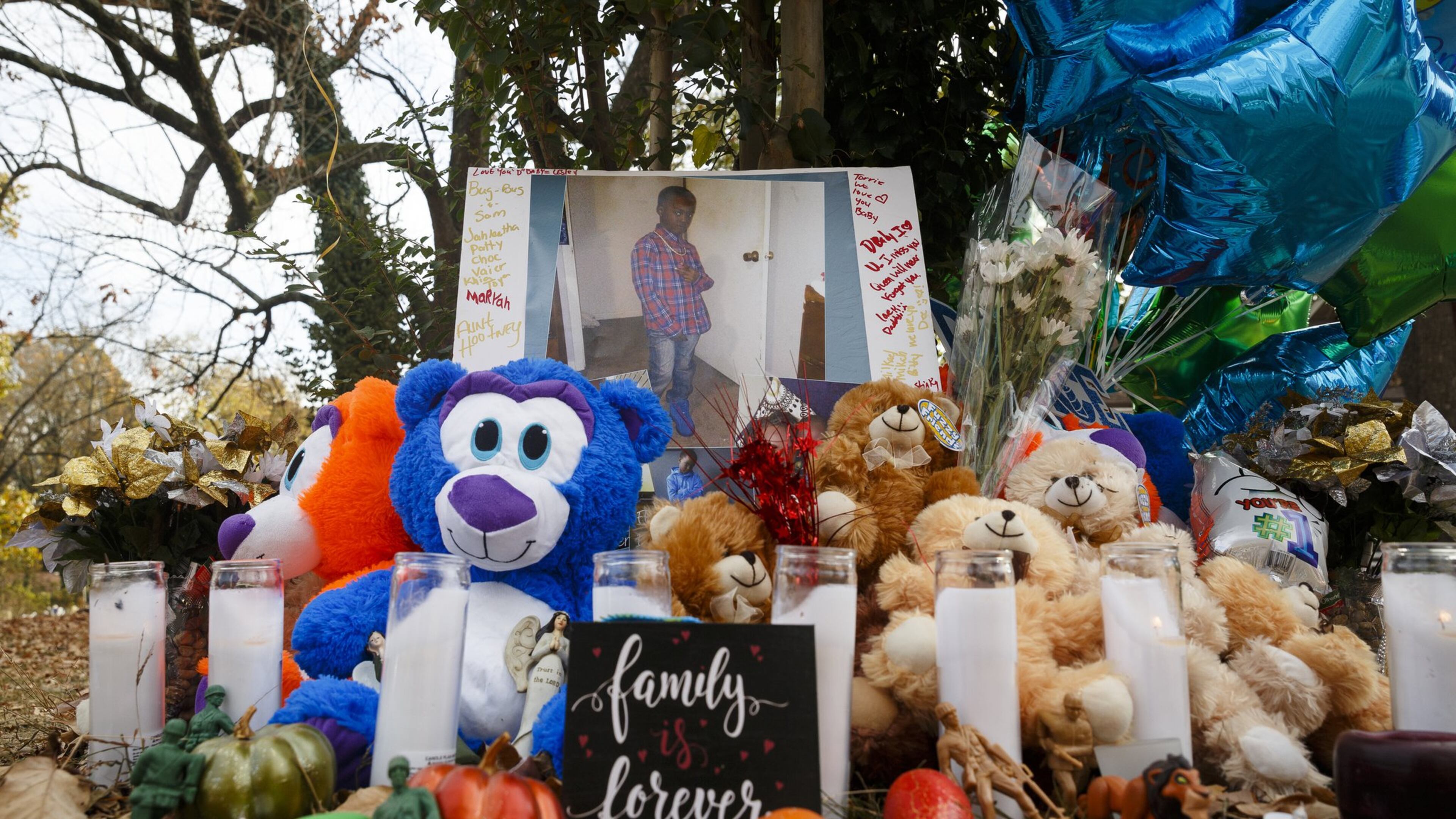 Teddy bears, mementos, and balloons make up a makeshift memorial at the site of Monday’s fatal school bus crash in Chattanooga, Tenn. The crash killed five Woodmore Elementary stuudents. (Doug Strickland / Chattanooga Times Free Press via AP)
