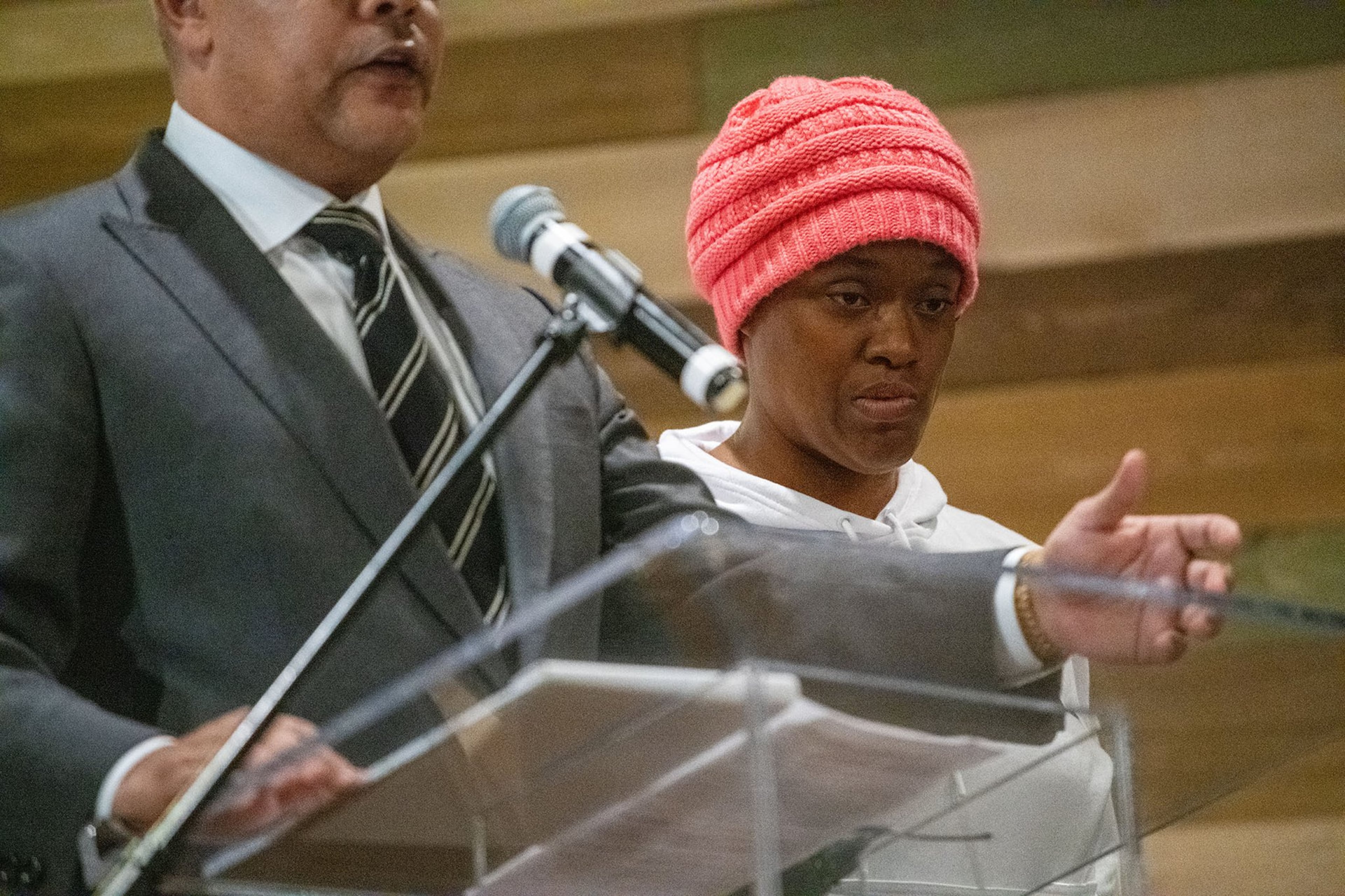 From left, Attorney Timothy Gardner speaks for his client Tiffany Wingo, at a town hall meeting to discuss the conditions at the Cobb County Detention Center Wingo’s brother died in the hospital after experiencing an unspecified medical emergency at the jail, which is still under investigation. PHOTO BY ELISSA BENZIE