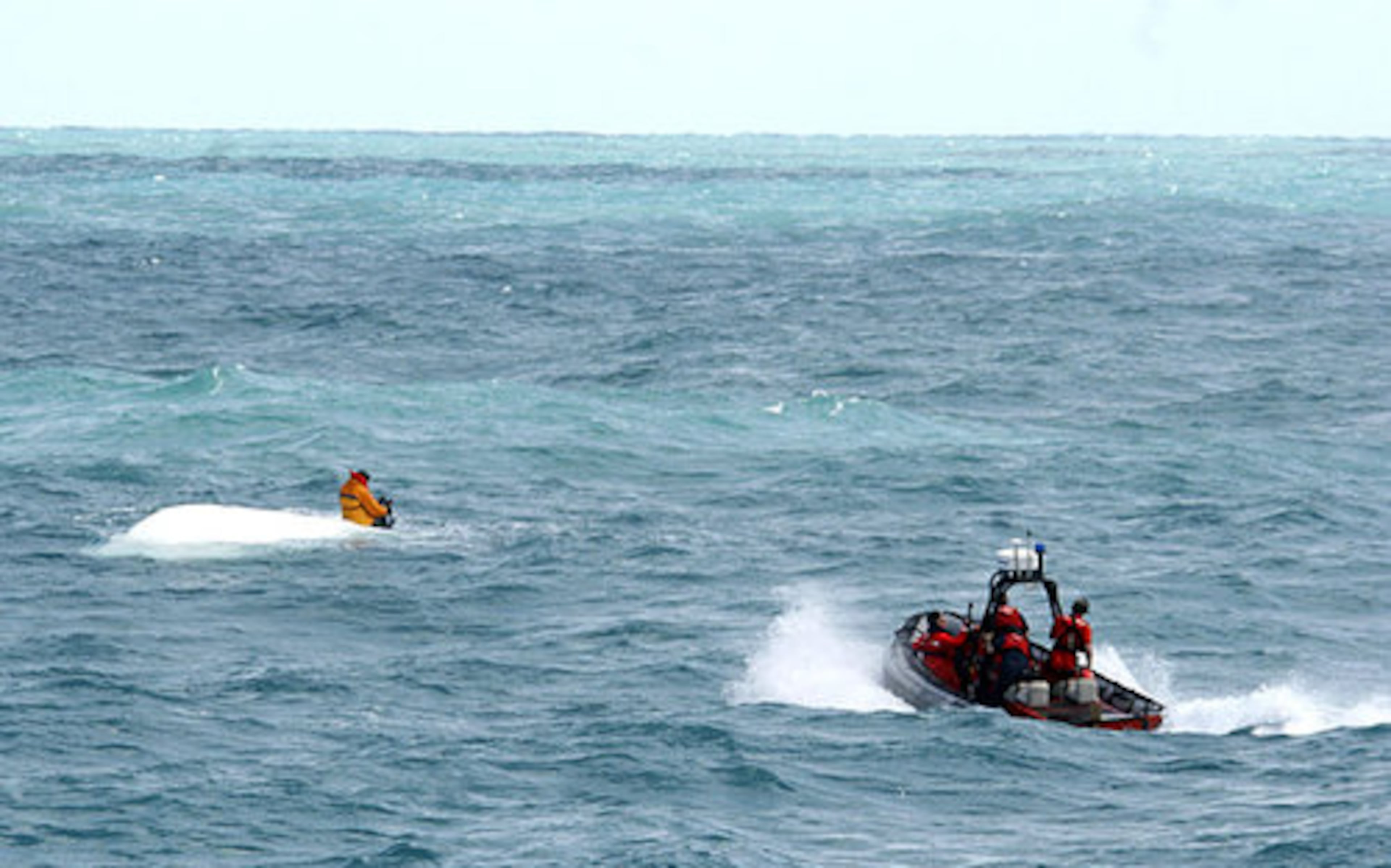 The Coast Guard approaches for the rescue.