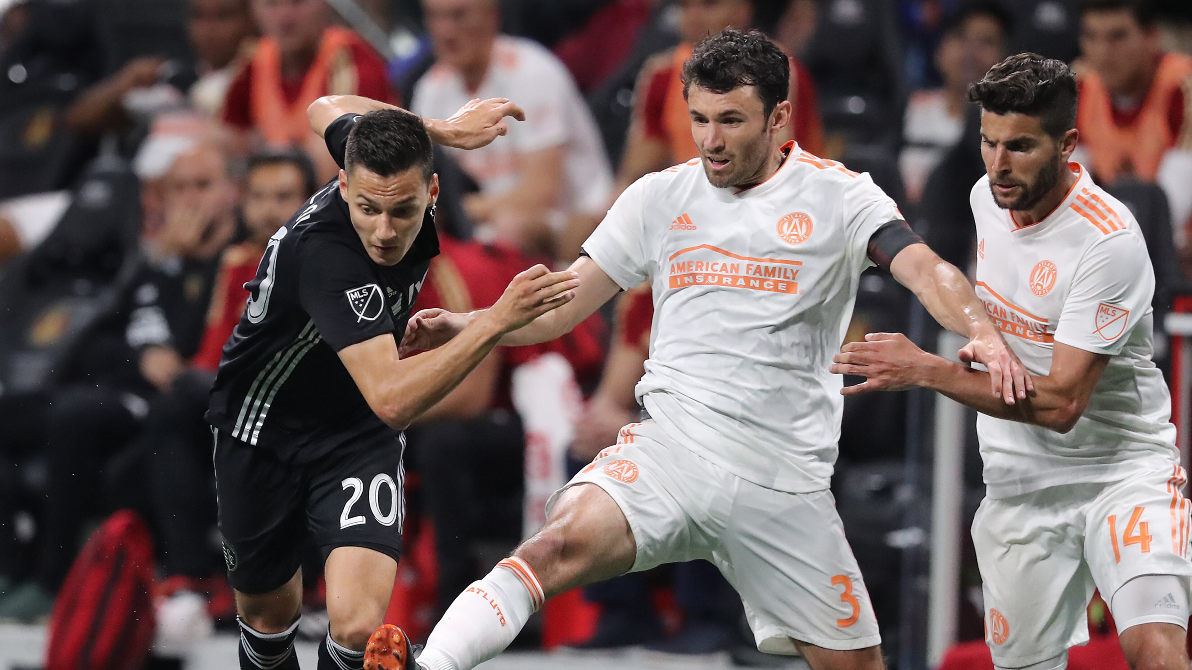 Atlanta United defender Michael Parkhurst kicks the ball away from Sporting Kansas City forward Daniel Salloi during the second half in a MLS soccer match on Wednesday, May 9, 2018, in Atlanta. Curtis Compton/ccompton@ajc.com