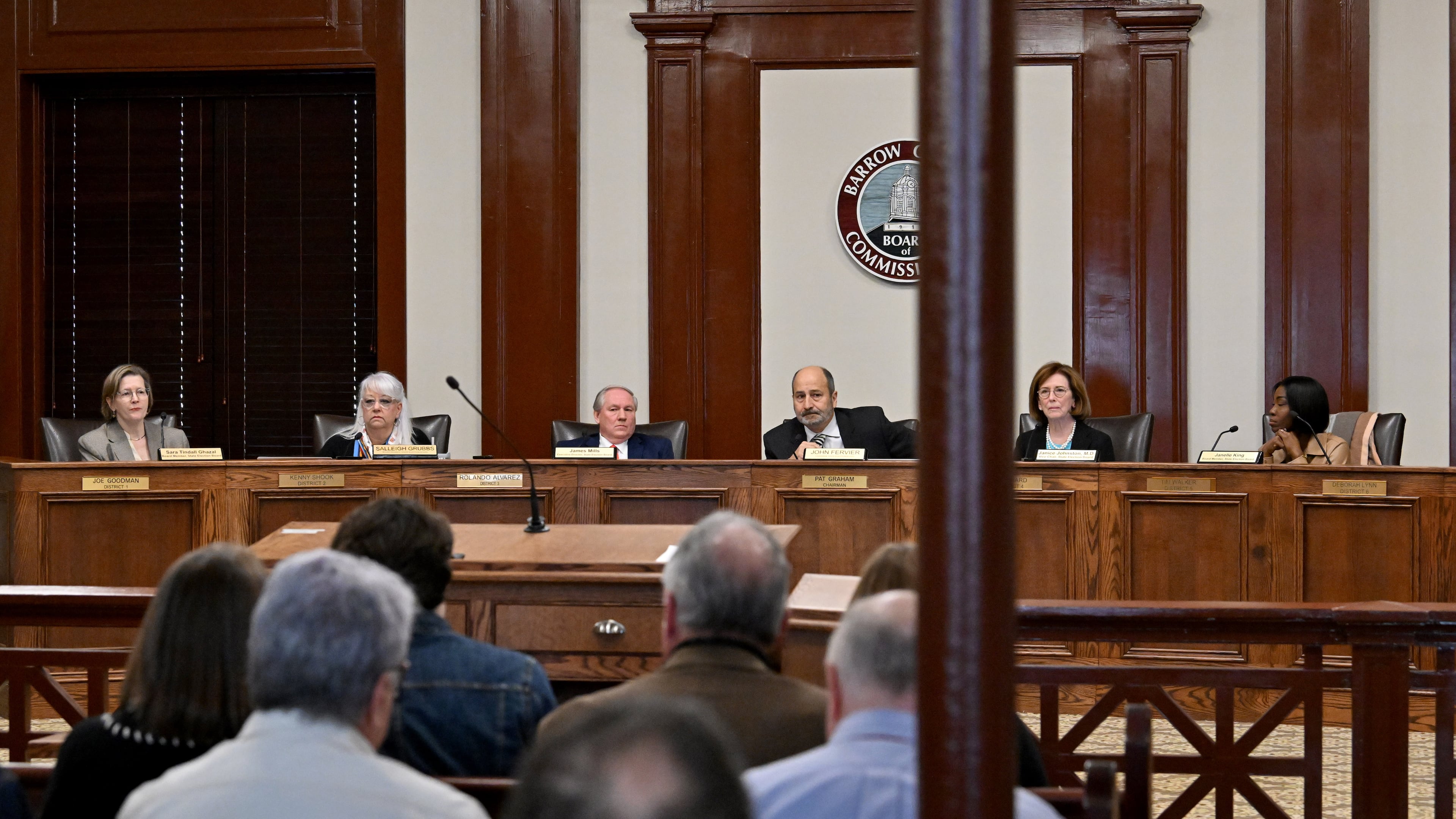 Georgia State Election Board members, from left, Sara Tindall Ghazal, Salleigh Grubbs, Executive Director James Mills, Chair John Fervier, Vice Chair Janice Johnston and Janelle King discuss agendas during the State Election Board’s monthly meeting at the Historic Barrow County Courthouse, Wednesday, Jan. 21, 2026, in Winder. (Hyosub Shin/AJC)