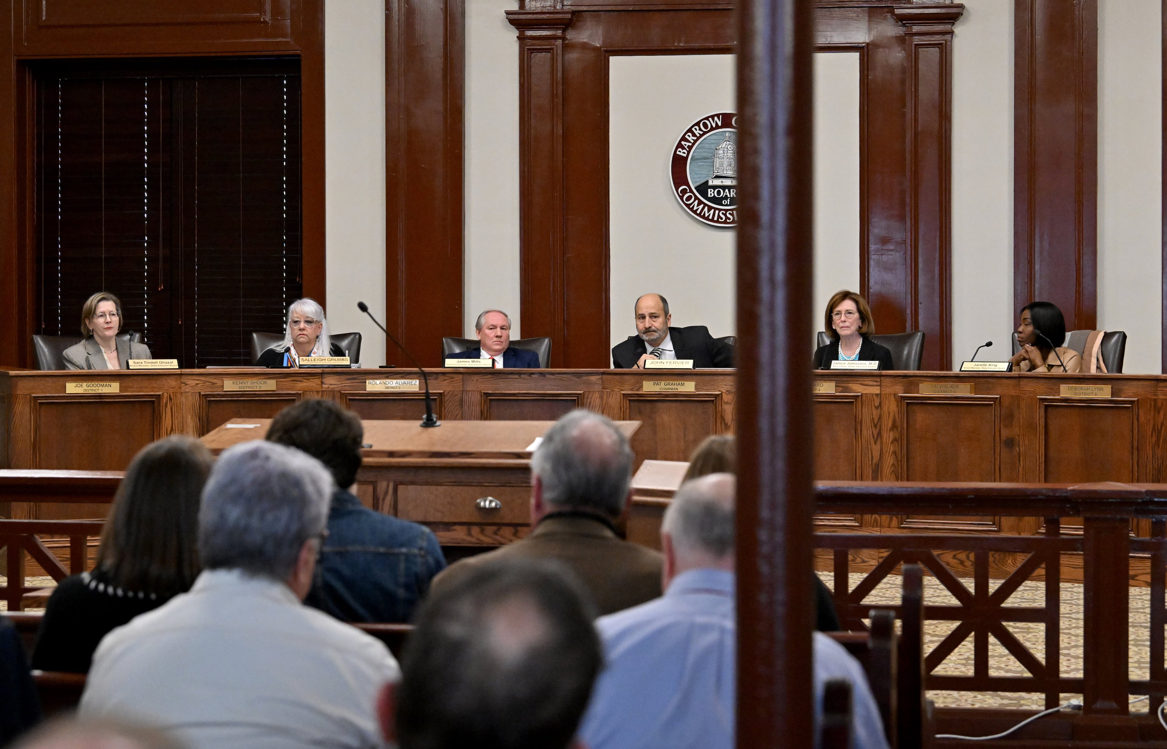 Georgia State Election Board members, from left, Sara Tindall Ghazal; Salleigh Grubbs; James Mills, executive director; John Fervier, chairman; Janice Johnston, vice chairman; and Janelle King discuss on agendas during the State Election Board’s monthly meeting at the Historic Barrow County Courthouse, Wednesday, Jan. 21, 2026, in Winder. (Hyosub Shin/AJC)