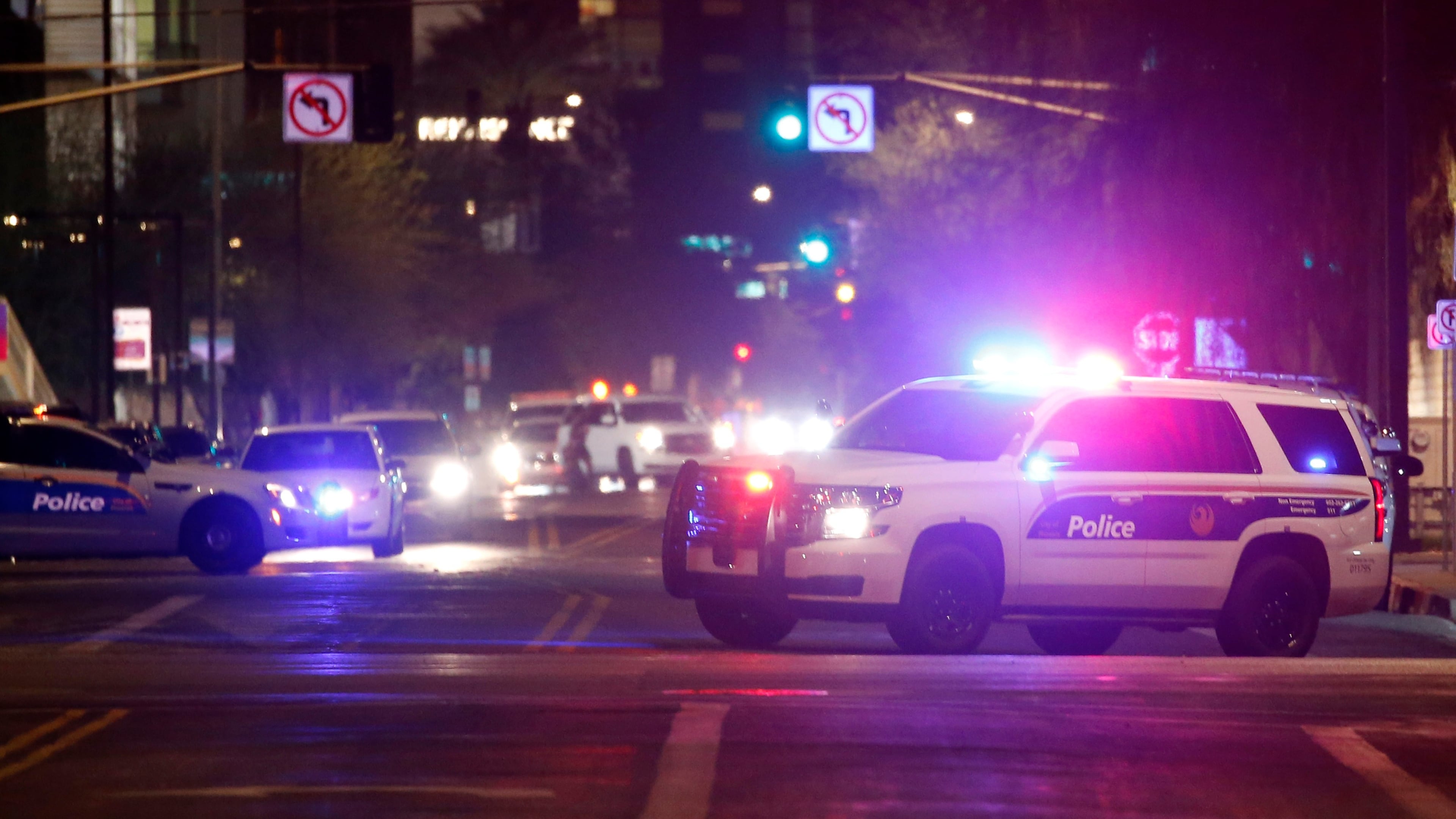 FILE - Phoenix Police Department vehicles block off a street in Phoenix, May 30, 2020. (AP Photo/Ross D. Franklin, File