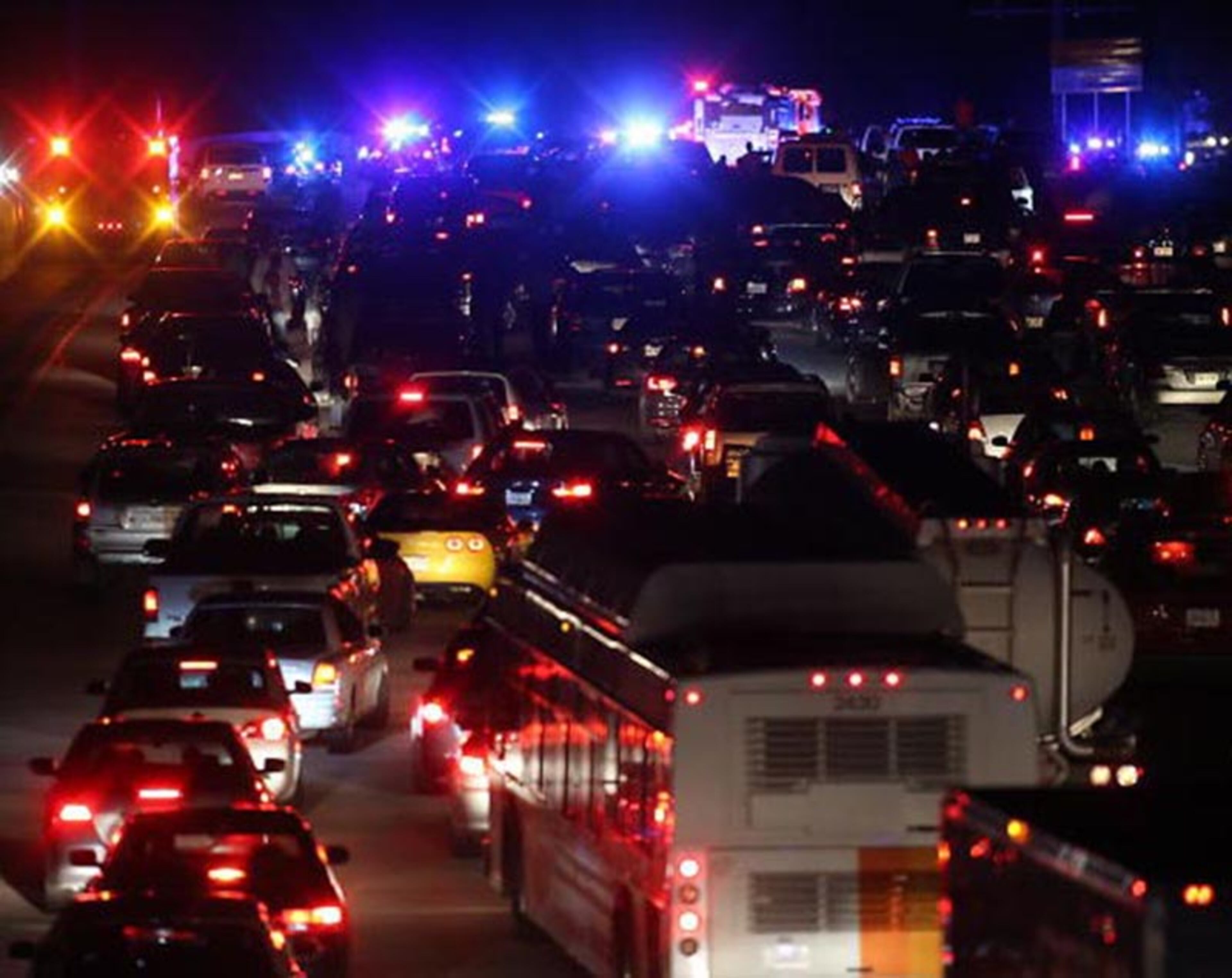 Ga. 400 southbound blocked north of Northridge Drive, the view is looking from Roberts Drive. The Alpharetta officer and a female motorist shot in the crossfire Friday night are expected to be okay. BEN GRAY / BGRAY@AJC.COM