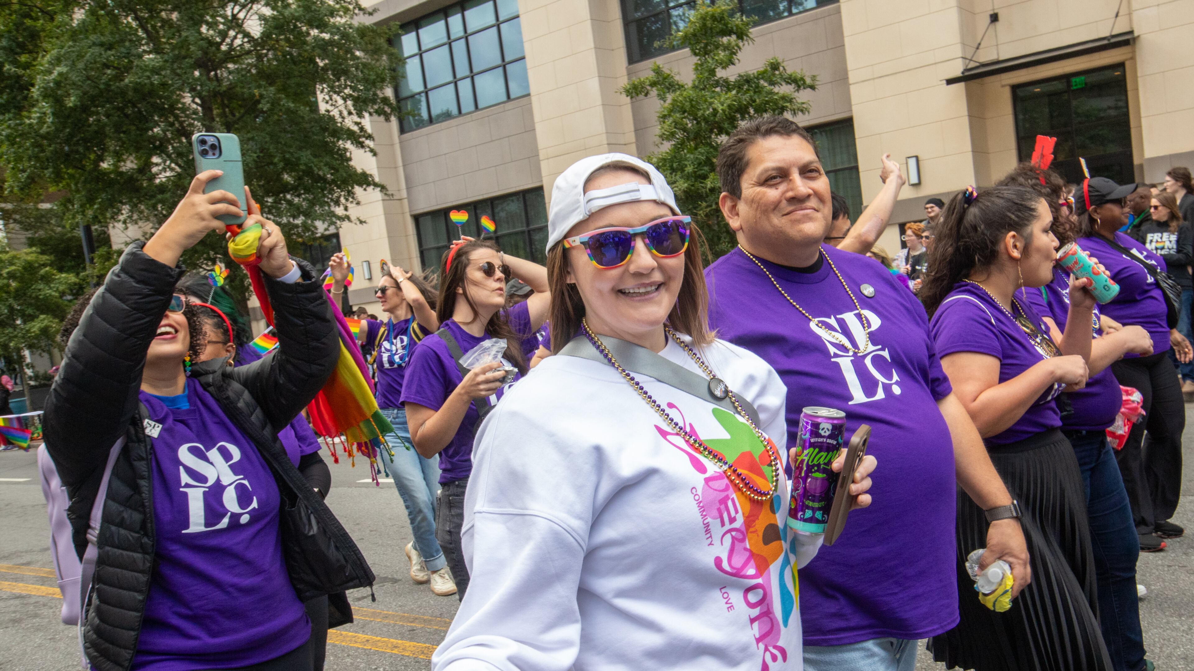 Katie Rinderle, the Cobb County teacher who was fired for reading a book that challenges gender norms to her students, marches with the law firm that represents her in the annual Pride Parade on Sunday, Oct 15, 2023. Rinderle is appealing her termination. (Jenni Girtman for The Atlanta Journal-Constitution)