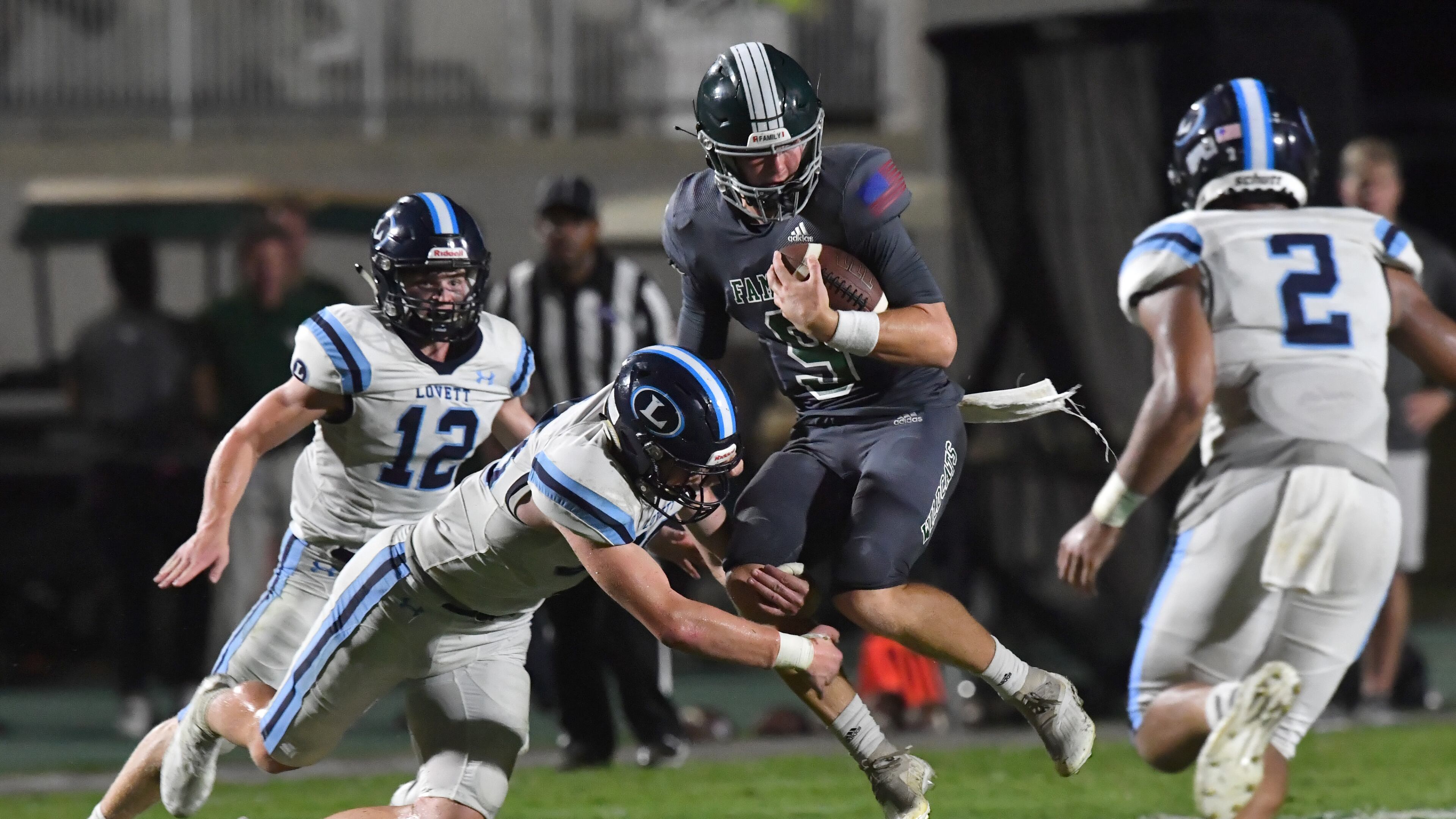 August 20, 2021 Atlanta - Westminster's QB John Collier (9) gets tackled by Lovett's Garrett Kelly (88) in the second half of their season opener game at The Westminster Schools in Atlanta on Friday, August 20, 2021. Westminster won 17-7 over Lovett. (Hyosub Shin / Hyosub.Shin@ajc.com)