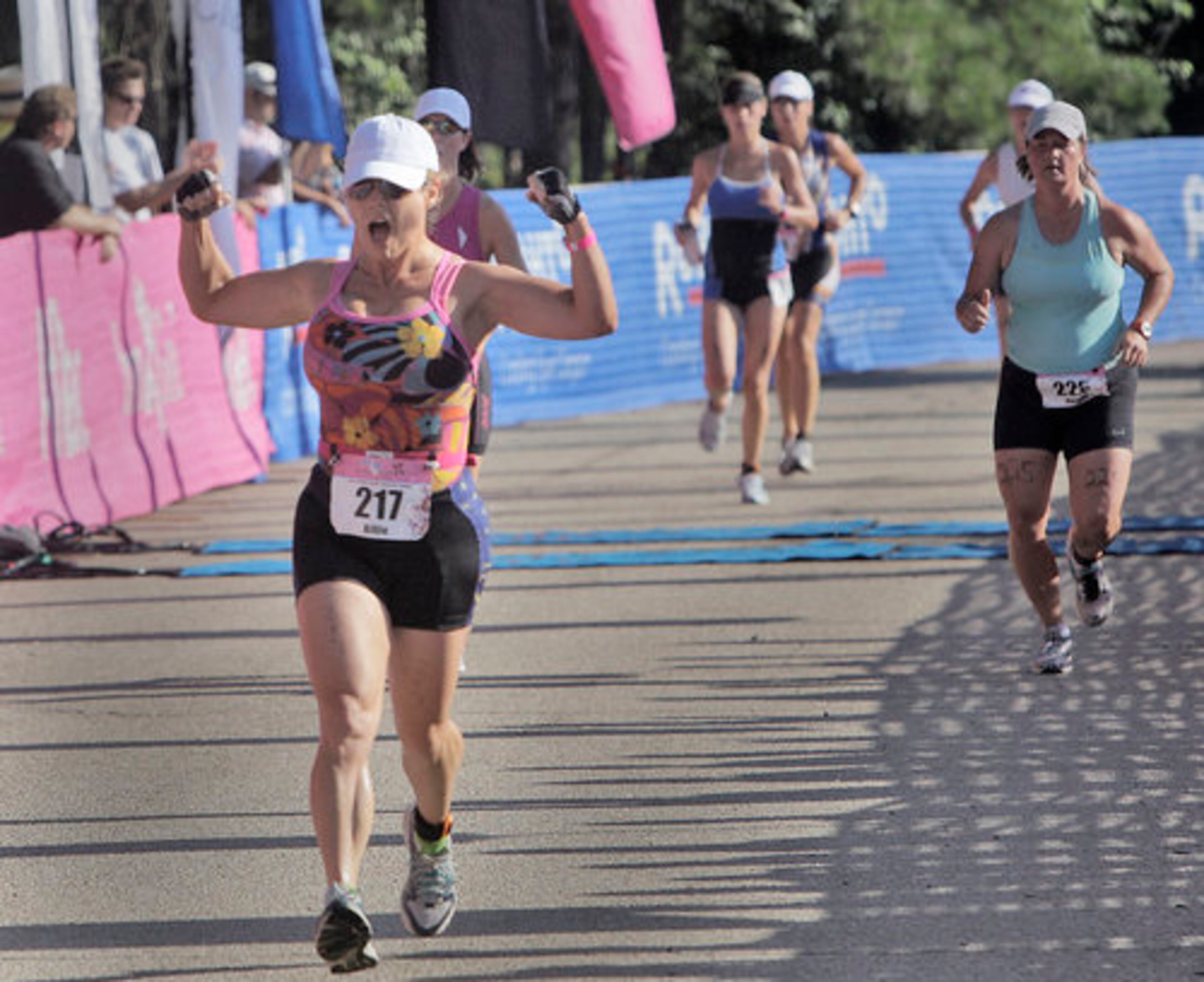Billie Clark, from Monroe, exults as she approaches the finish line.