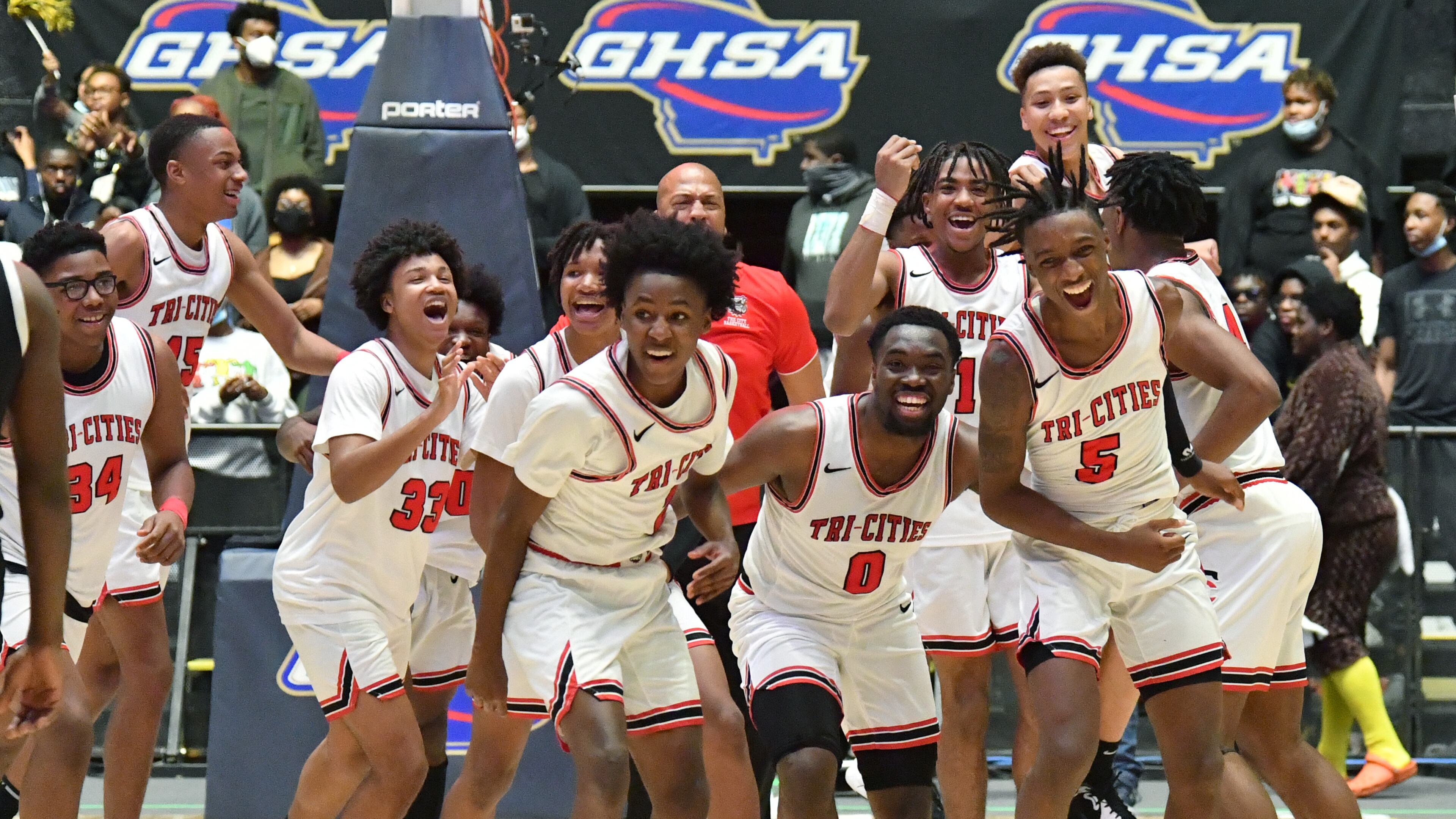 March 10, 2022 Macon - Tri-Cities players celebrate their victory over Eagle's Landing during the 2022 GHSA State Basketball Class AAAAA Boys Championship game at the Macon Centreplex in Macon on Thursday, March 10, 2022. Tri-Cities won 67-59 over Eagle's Landing. (Hyosub Shin / Hyosub.Shin@ajc.com)