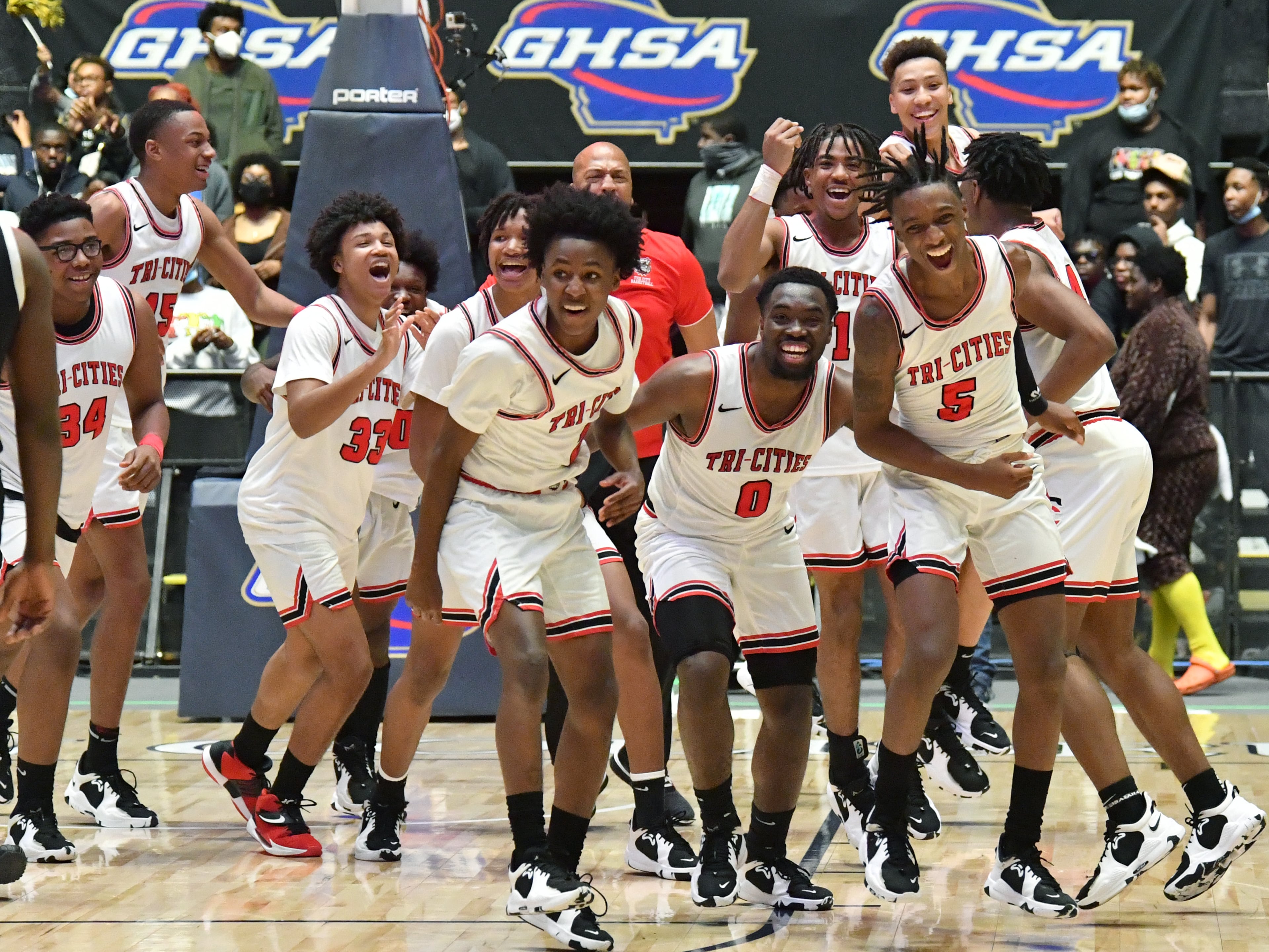 Tri-Cities players celebrate their victory over Eagle's Landing. (Hyosub Shin / Hyosub.Shin@ajc.com)