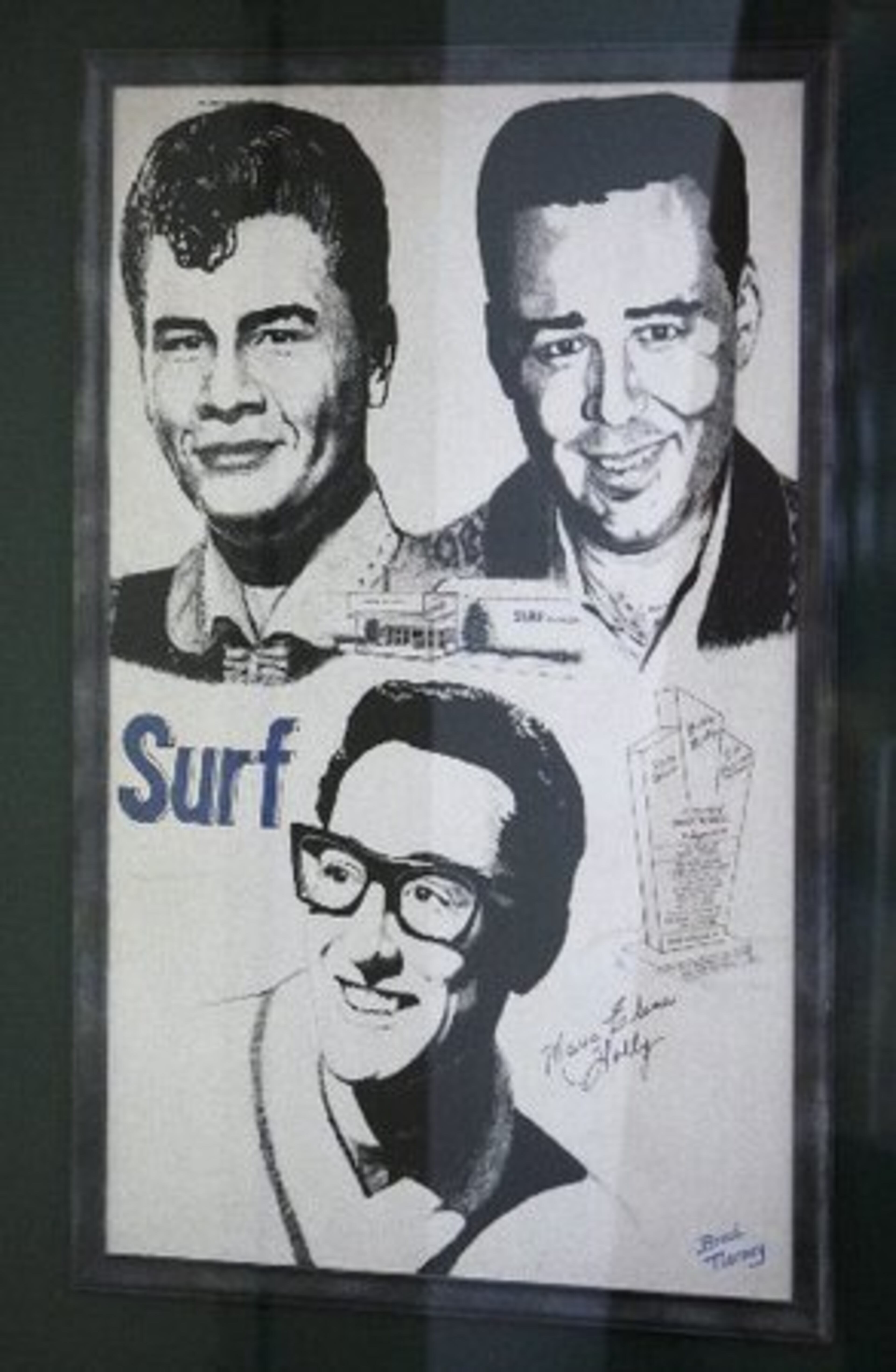 A poster showing Buddy Holly, Ritchie Valens and J.P. "The Big Bopper" Richardson hangs on a wall in the Surf Ballrom in Clear Lake, Iowa. It's been 50 years since the single-engine plane crashed into a snow-covered Iowa field killing everyone on board. Their deaths became known as "the day the music died," as described in Don McLean's song "American Pie."