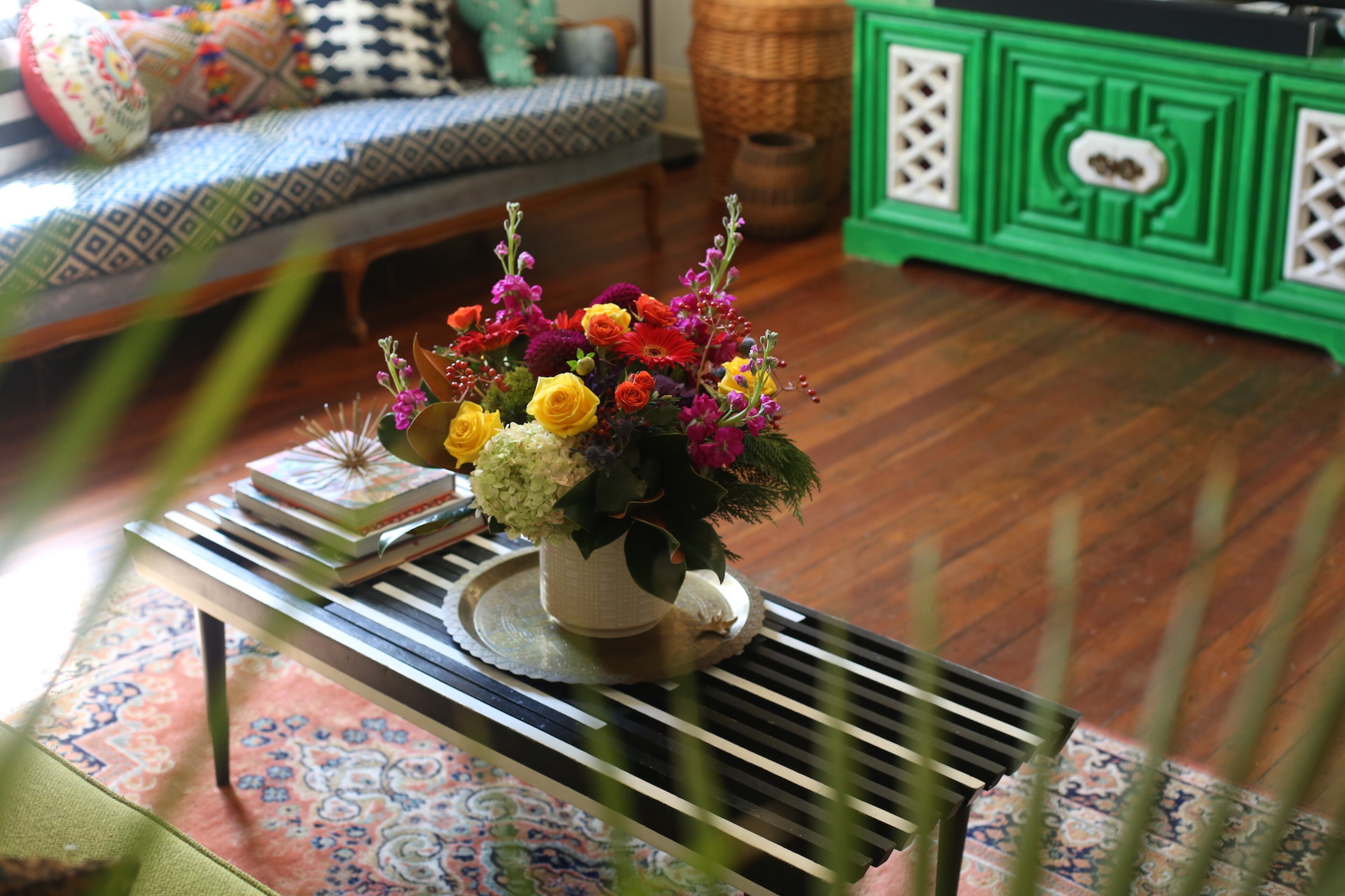 Flowers from a neighbor add to the colorful character in the living room, which has a TV cabinet painted Valspar's Luscious Green. Homeowner Augusta Wheeler said she doesn't let color or pattern dictate her point of view. "Keeping your home neat and tidy can really bring a room together more than anything," she added. Text and photos by Fast Copy News Service's Lori Johnston and Lyric Lewin.