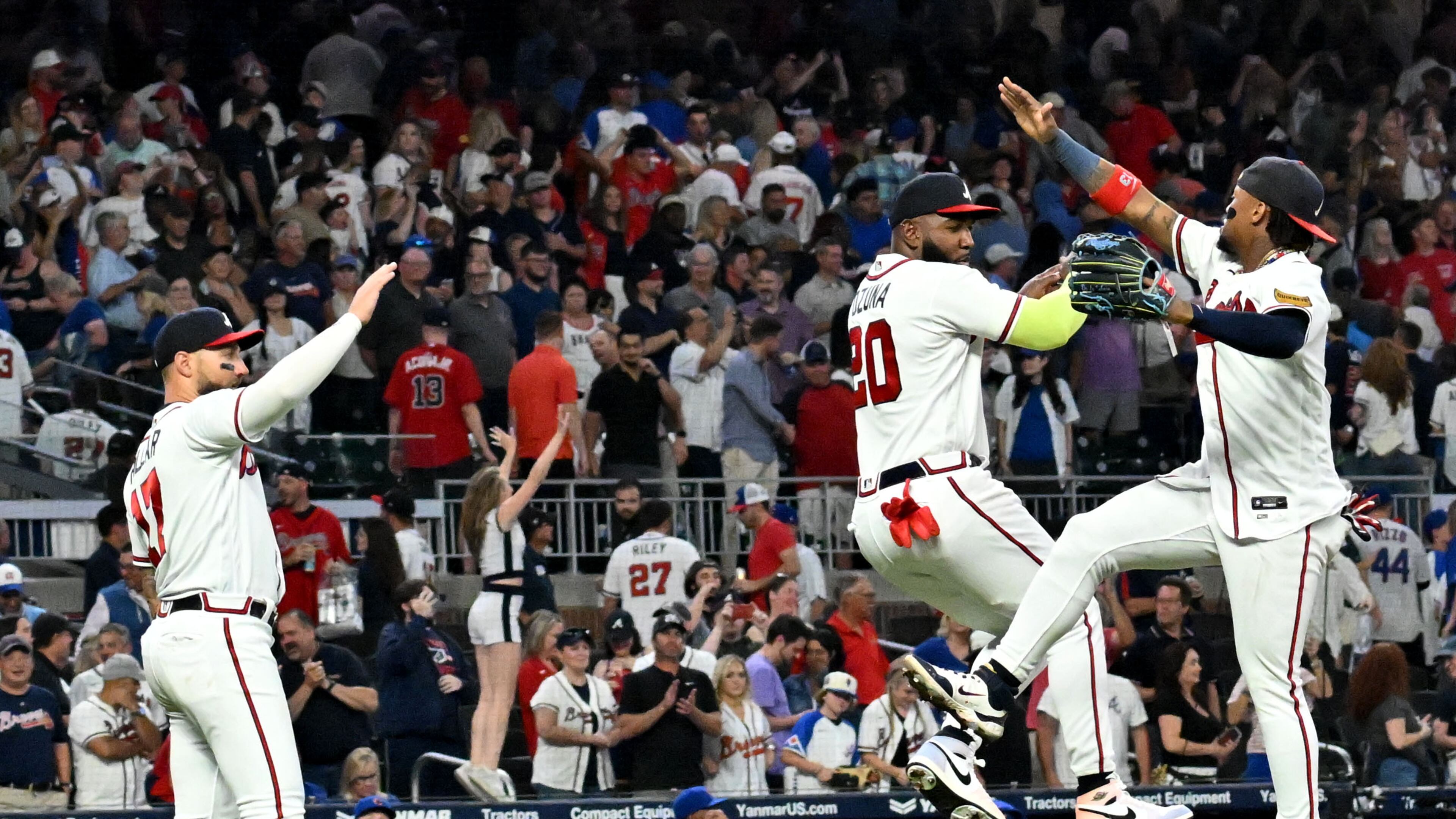 Atlanta Braves' designated hitter Marcell Ozuna (20) and Atlanta Braves' right fielder Ronald Acuna Jr. (13) celebrate their win over Chicago Cubs at Truist Park, Tuesday, September 26, 2023, in Atlanta. Atlanta Braves won 7-6 over Chicago Cubs.(Hyosub Shin / Hyosub.Shin@ajc.com)