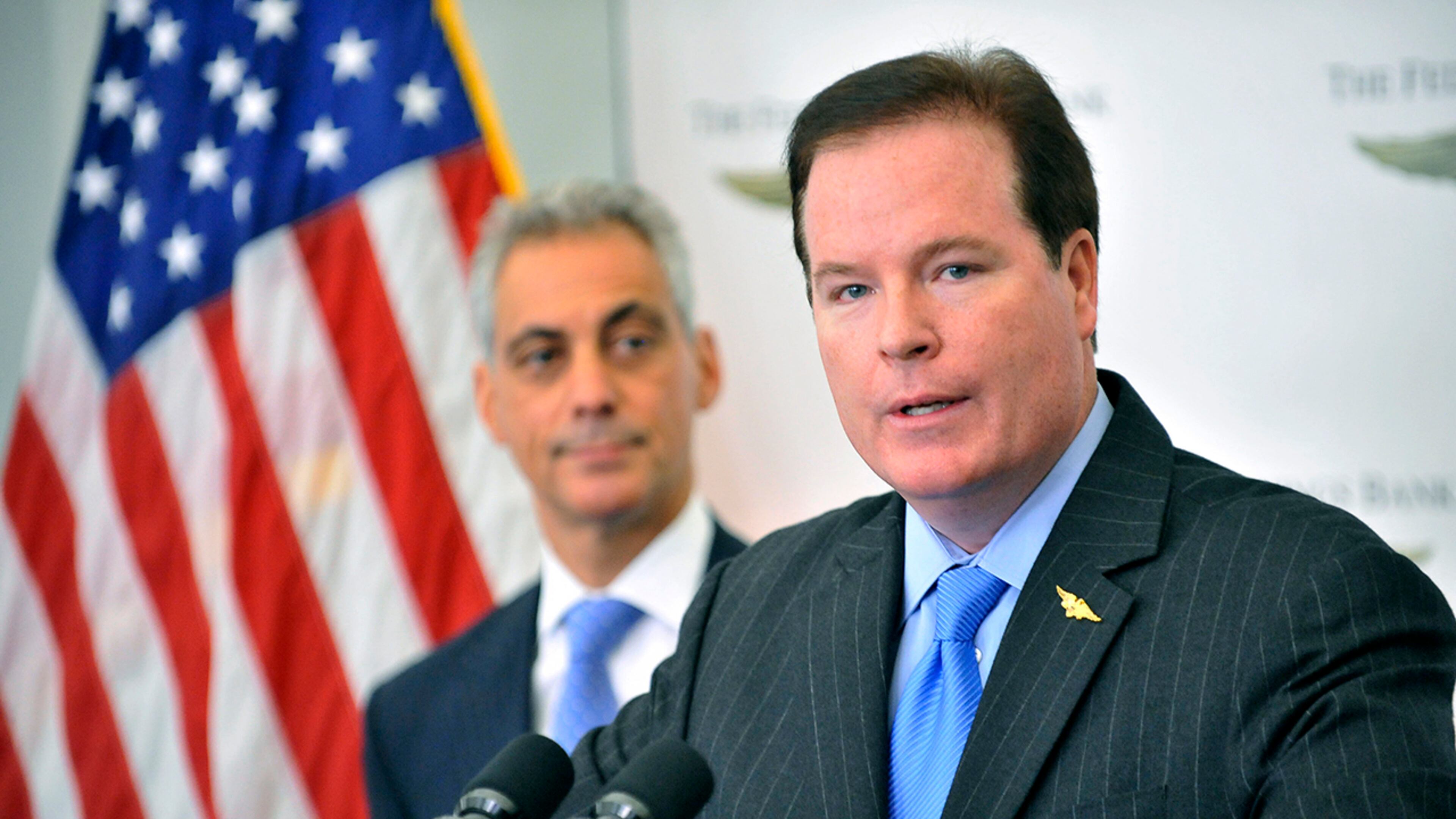 In this June 28, 2012 photo, Stephen M. Calk, Chairman and Chief Financial Official of The Federal Savings Bank speaks as Chicago Mayor Rahm Emanuel listens during an announcement about job growth and economic development and a corporate headquarters relocation by the Federal Savings Bank to Chicago. Calk, who prosecutors say tried to buy himself a senior post in President Donald Trump's administration by making risky loans to former Trump campaign chairman Paul Manafort, was arrested Thursday, May 23, 2019, on a financial institution bribery charge. (Al Podgorski/Chicago Sun-Times via AP)