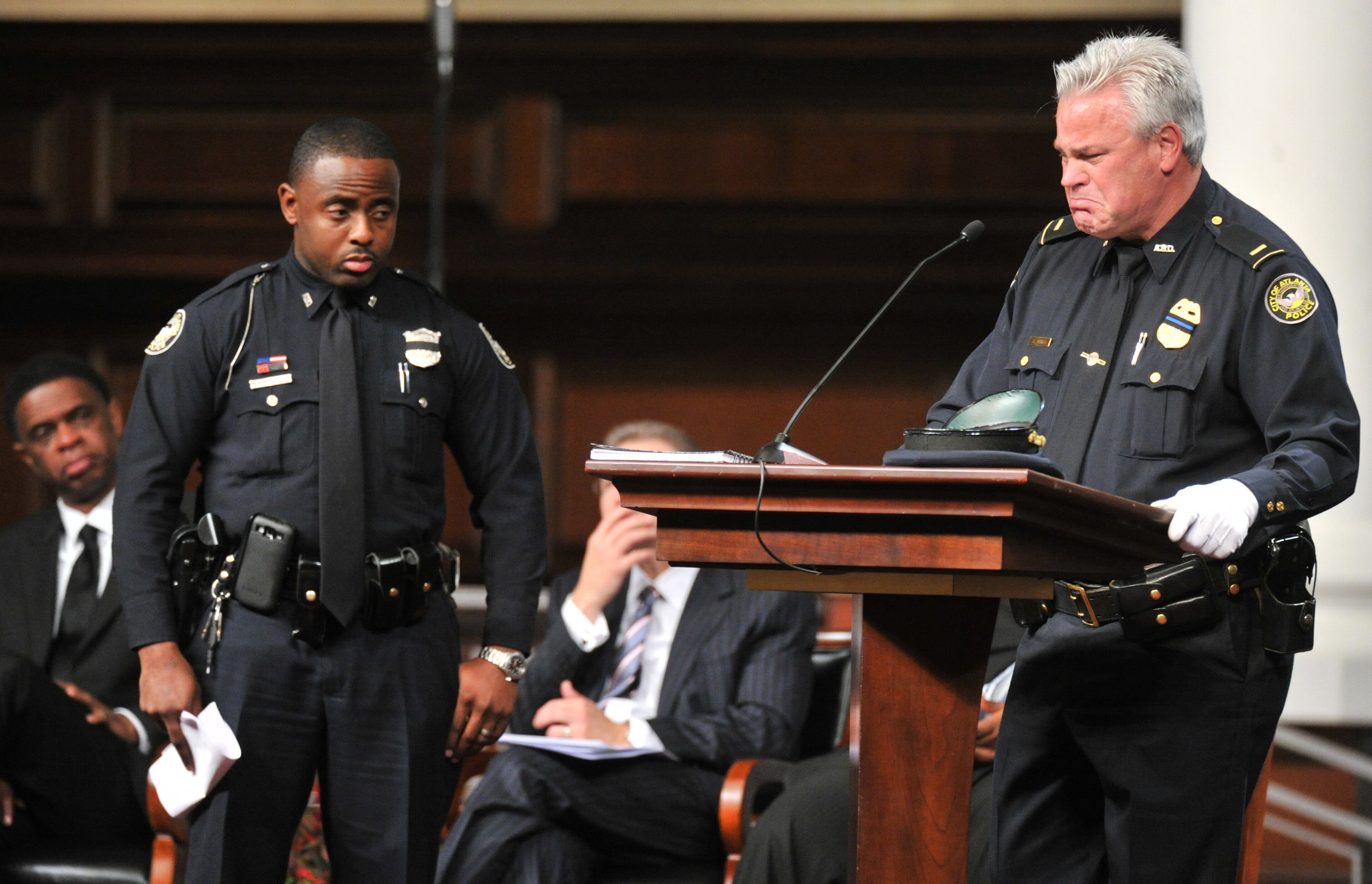 APD Lt. Jeffrey Hensal is overcome by emotion during APD Officer Shawn Smiley's funeral at First Baptist Church of Atlanta on Saturday, November 10, 2012. APD Officer Shawn Smiley was in the passenger seat last weekend when an APD helicopter searching for a missing 9-year-old boy crashed in Atlanta. HYOSUB SHIN / HSHIN@AJC.COM