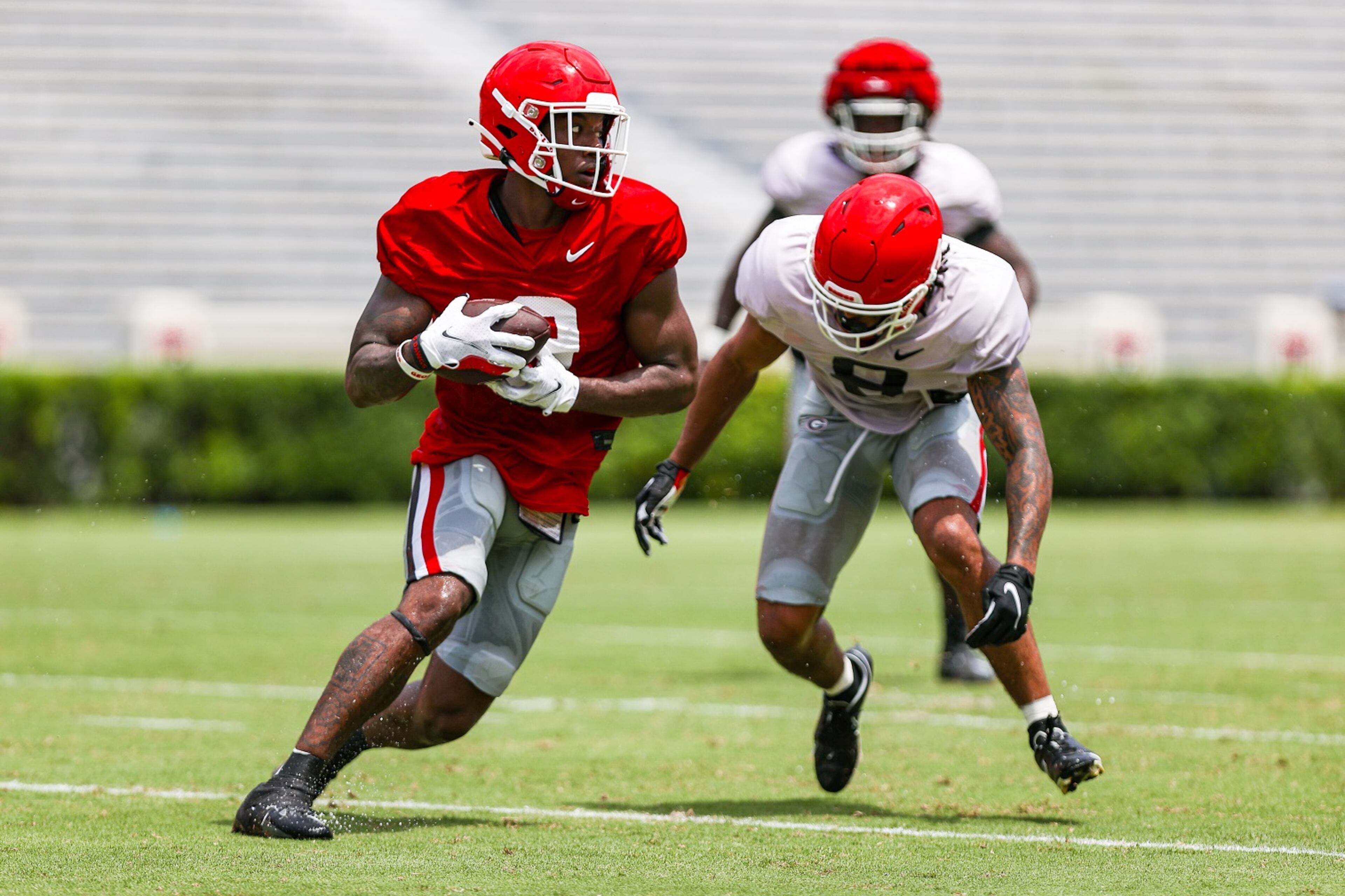 Georgia wide receiver Jackson Meeks makes a move as a tackler approaches. (Tony Walsh/UGAAA)