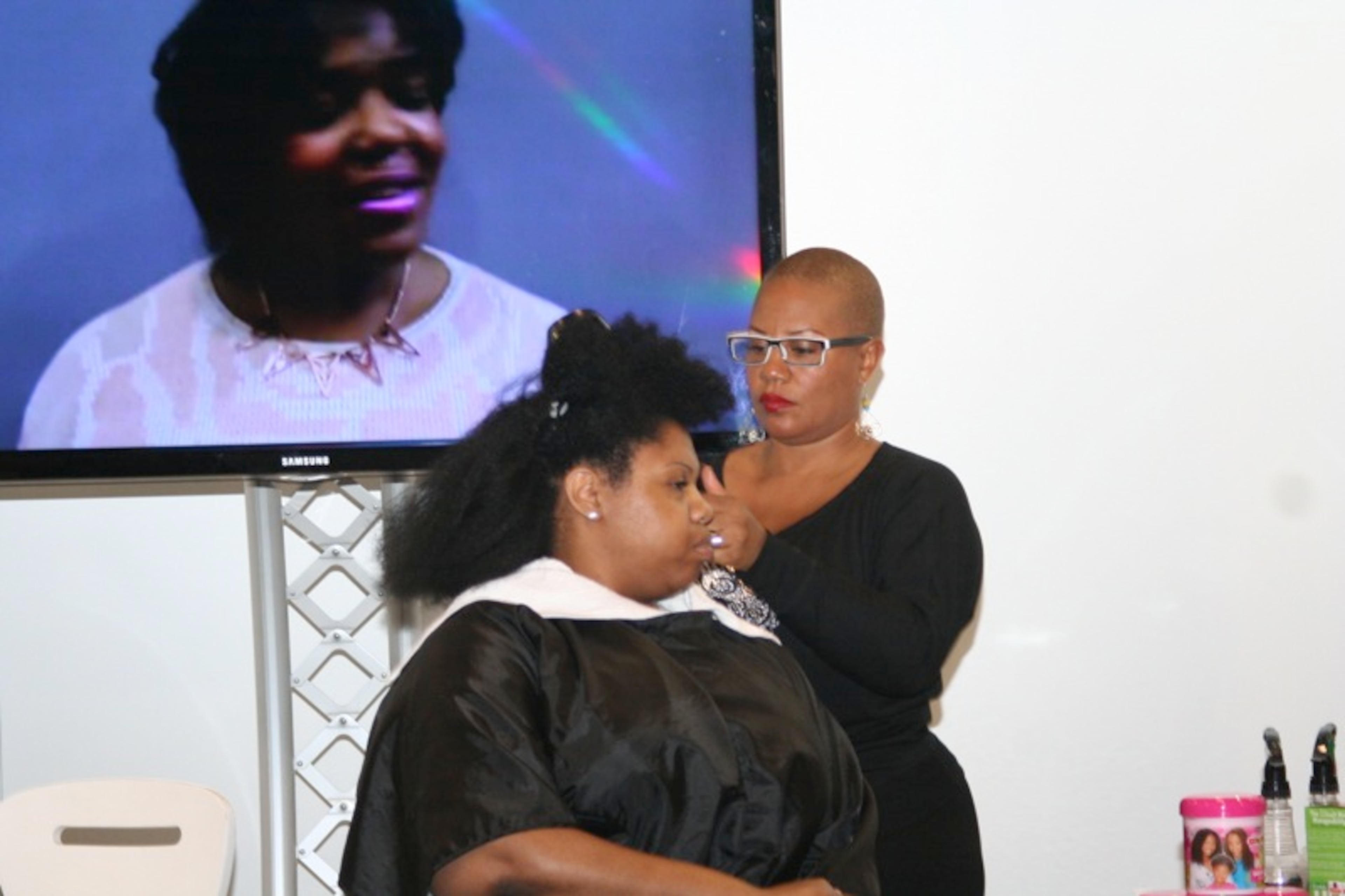 Felicia Leatherwood conducts a hair makeover and demonstration.