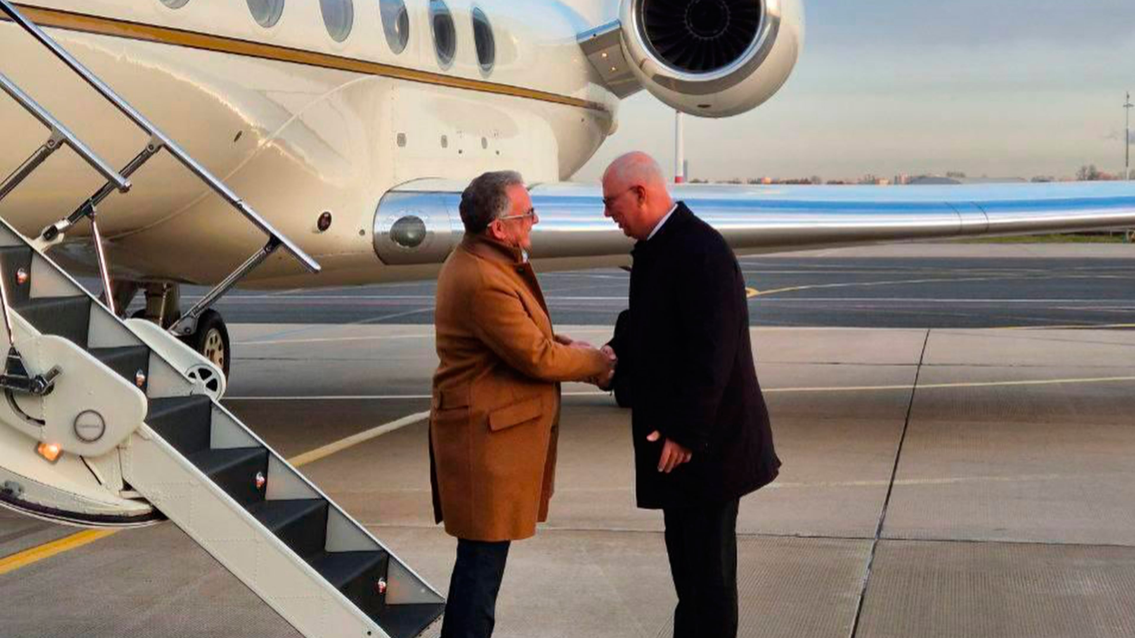 Russian presidential envoy Kirill Dmitriev, right, greets U.S. special envoy Steve Witkoff at the international airport outside St. Petersburg, Russia, Wednesday, Oct. 21, 2026. (TASS Photo via AP)