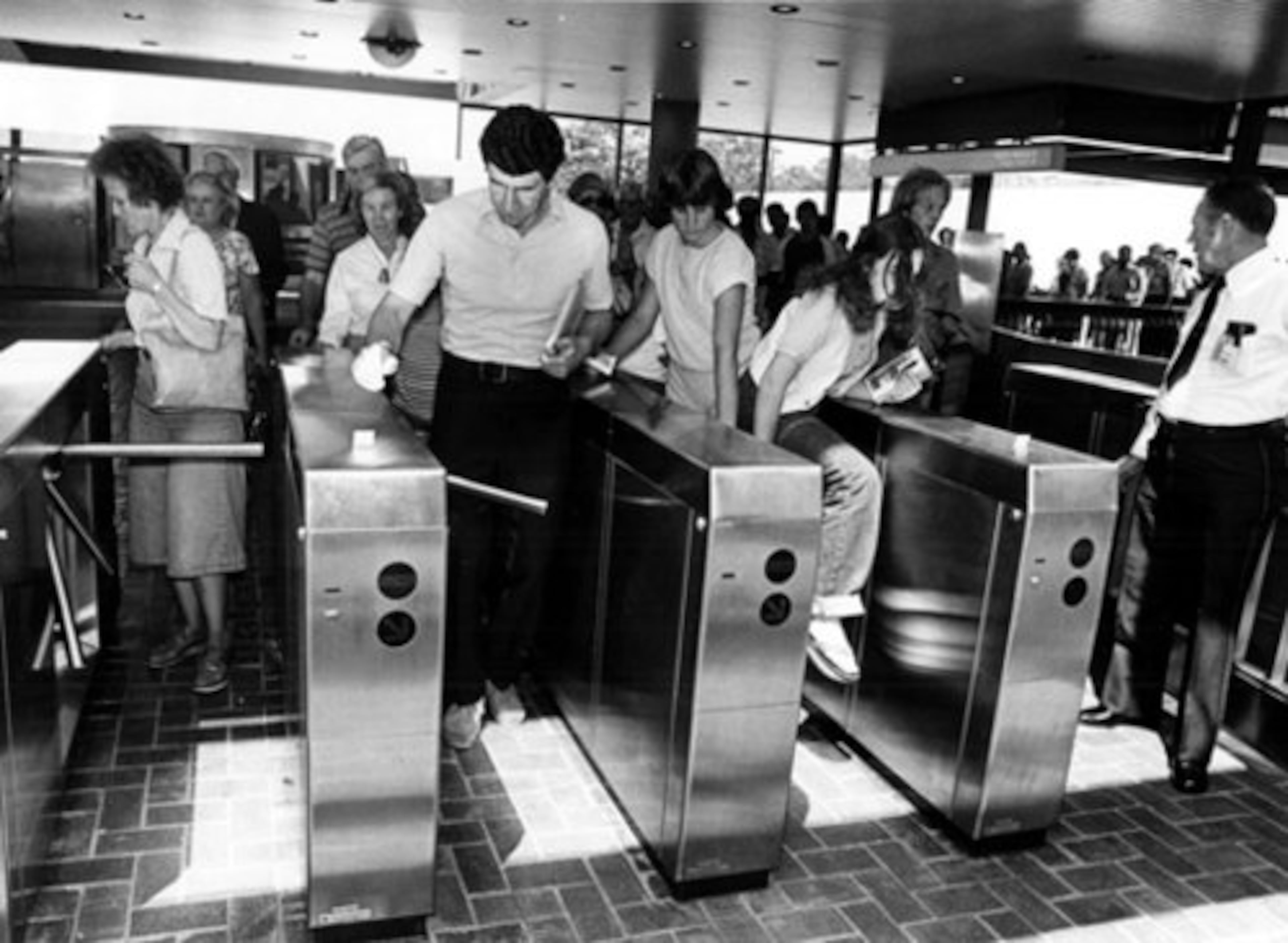At the Avondale MARTA station in 1979, the first passengers came through the turnstiles -- or like the girl on the right, climbed over after some of the gates failed to work.