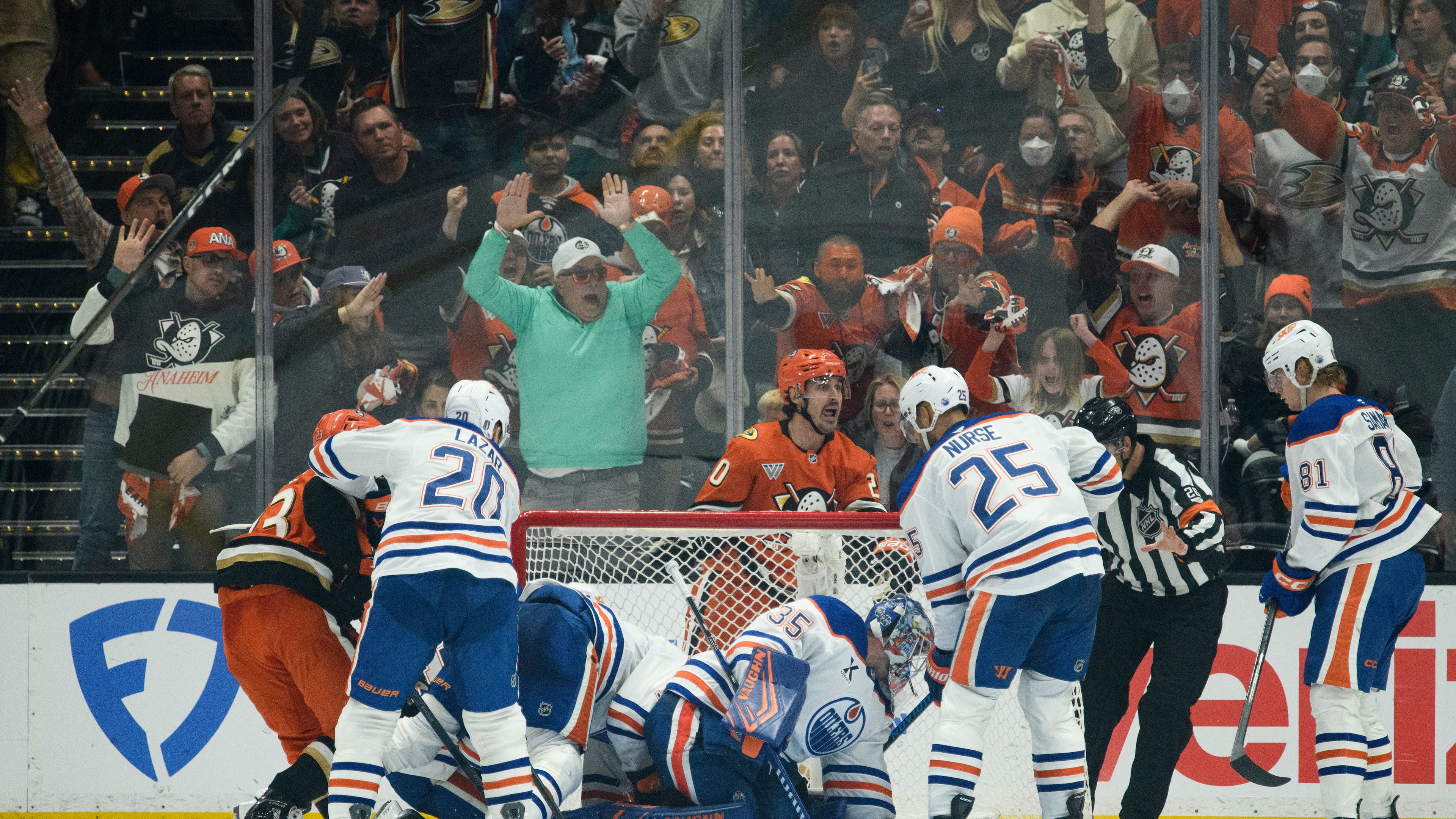 Anaheim Ducks left wing Chris Kreider, top center, reacts on the game-winning, overtime goal by center Ryan Poehling, not shown, in Game 4 in the first round of an NHL hockey Stanley Cup playoff series against the Edmonton Oilers, Sunday, April 26, 2026, in Anaheim, Calif. (AP Photo/Kyusung Gong)