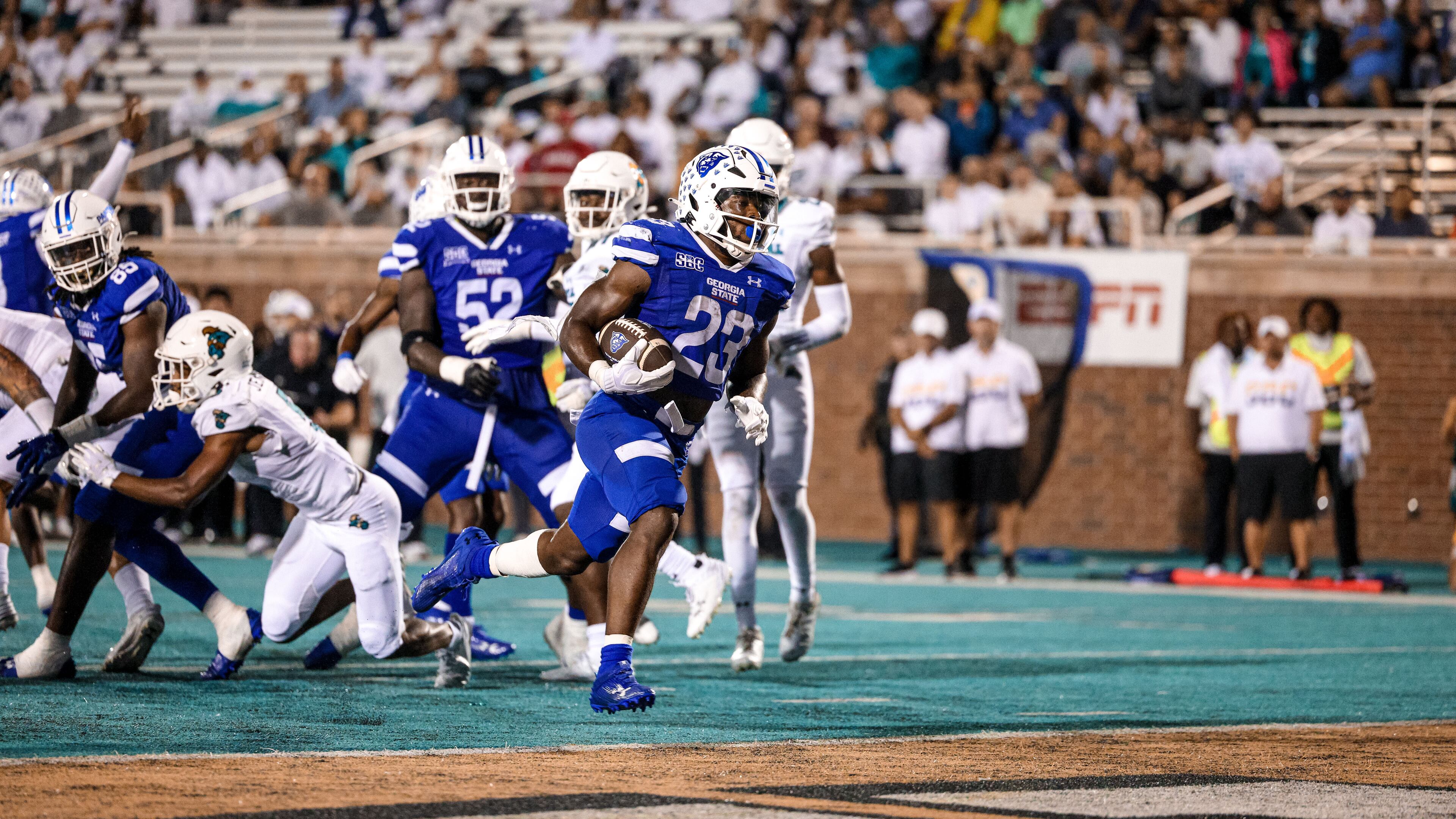 Marcus Carroll scores on a 7-yard run in the 30-17 win over Coastal Carolina in Conway, S.C. Carroll ran 29 times for 150 yards and one touchdown.