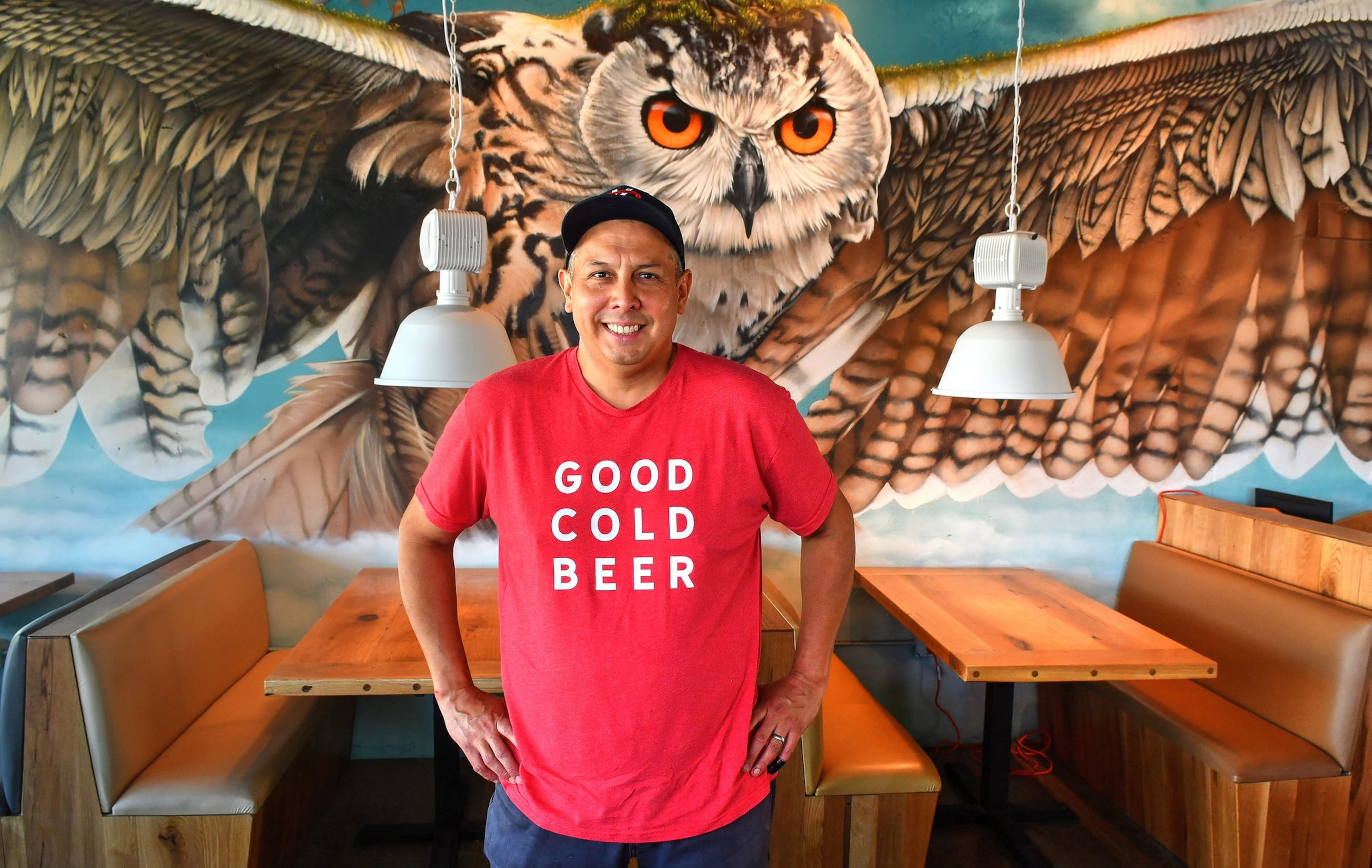 Chef/owner Andy Gonzales stands in front of the mural by local artist Thomas Turner at the Companion. CONTRIBUTED BY CHRIS HUNT PHOTOGRAPHY