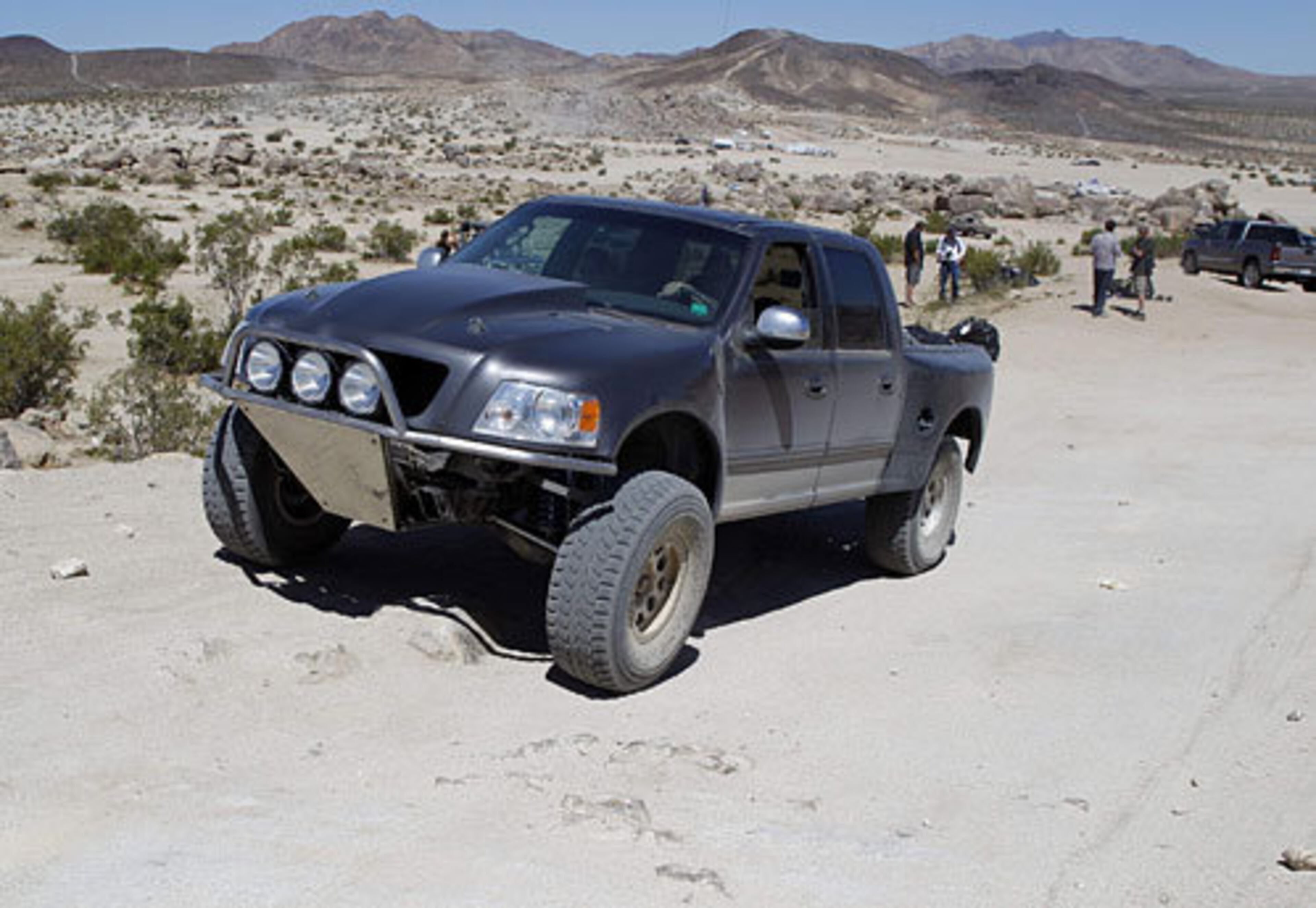 The scene Sunday at the site of the California 200 appears calm, with little evidence of the previous night's tragedy. But a small cross and a circle of rocks were placed Sunday near the ruts in the ground left by the truck.