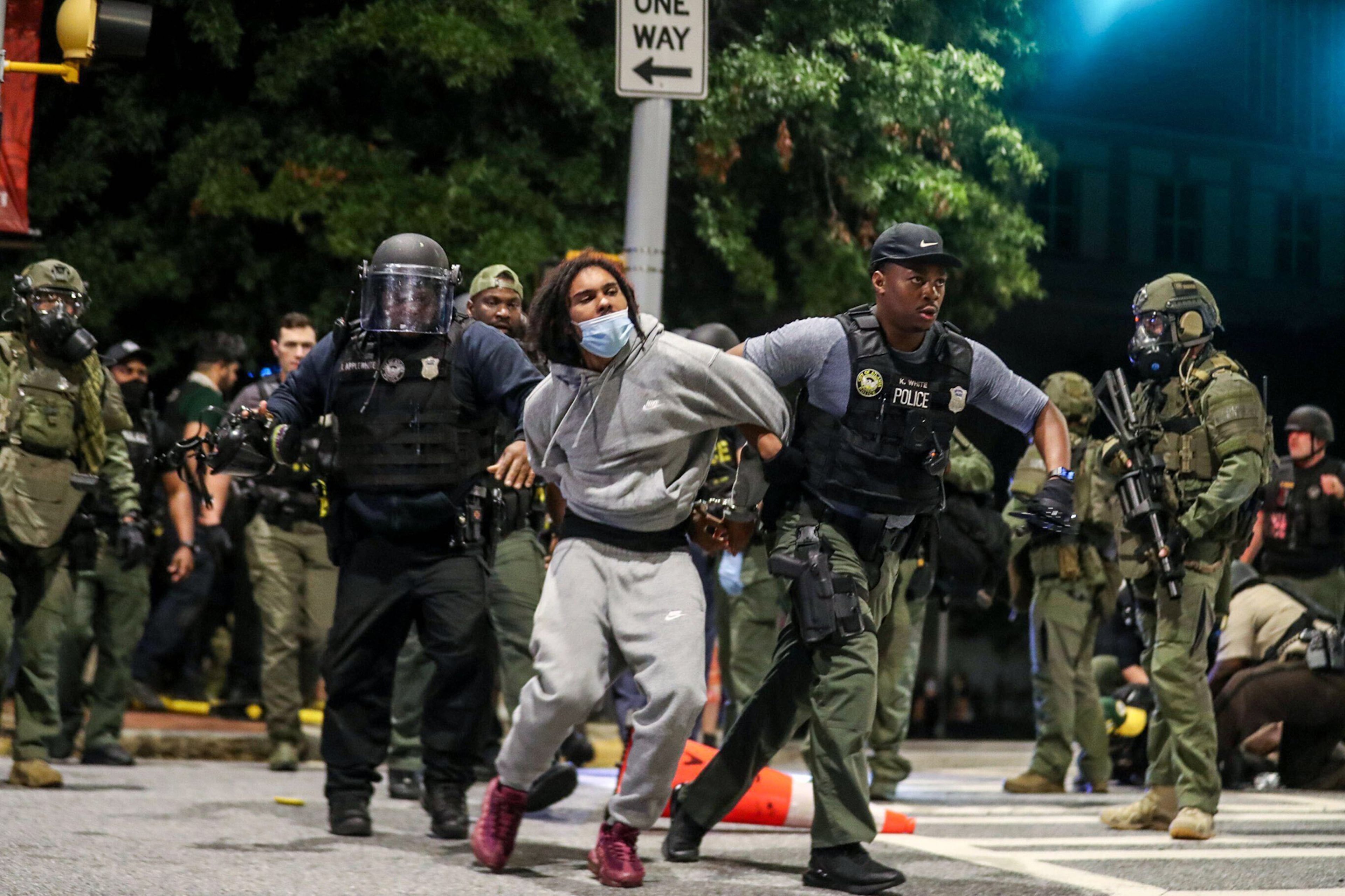 The demonstrator is taken into custody Wednesday, Sept. 23, 2020, in downtown Atlanta, after being chased down Washington Street by an Atlanta police officer. (Alyssa Pointer / Alyssa.Pointer@ajc.com)