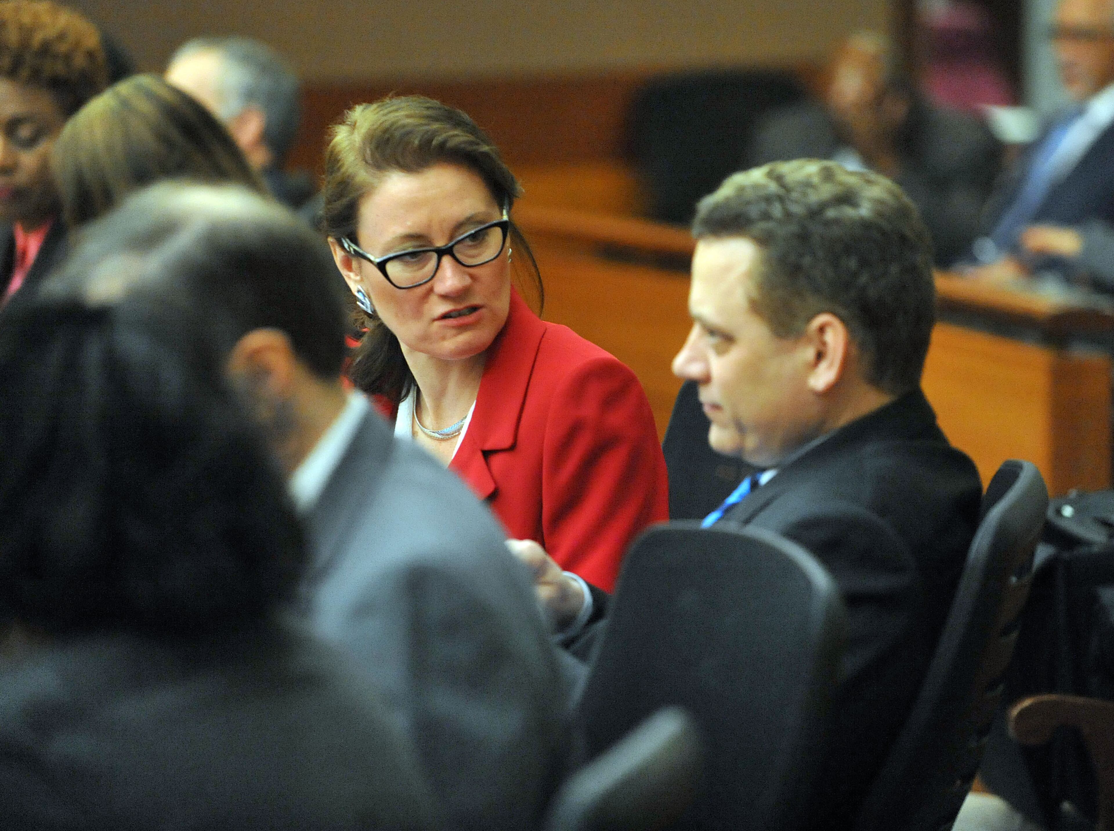 Fulton County Deputy DA Linda Dunikoski and Fulton County Deputy DA Brett Pinion talk while a waiting a jury verdict Monday in the Atlanta Public Schools test-cheating trial. (Atlanta Journal-Constitution, Kent D. Johnson, Pool)