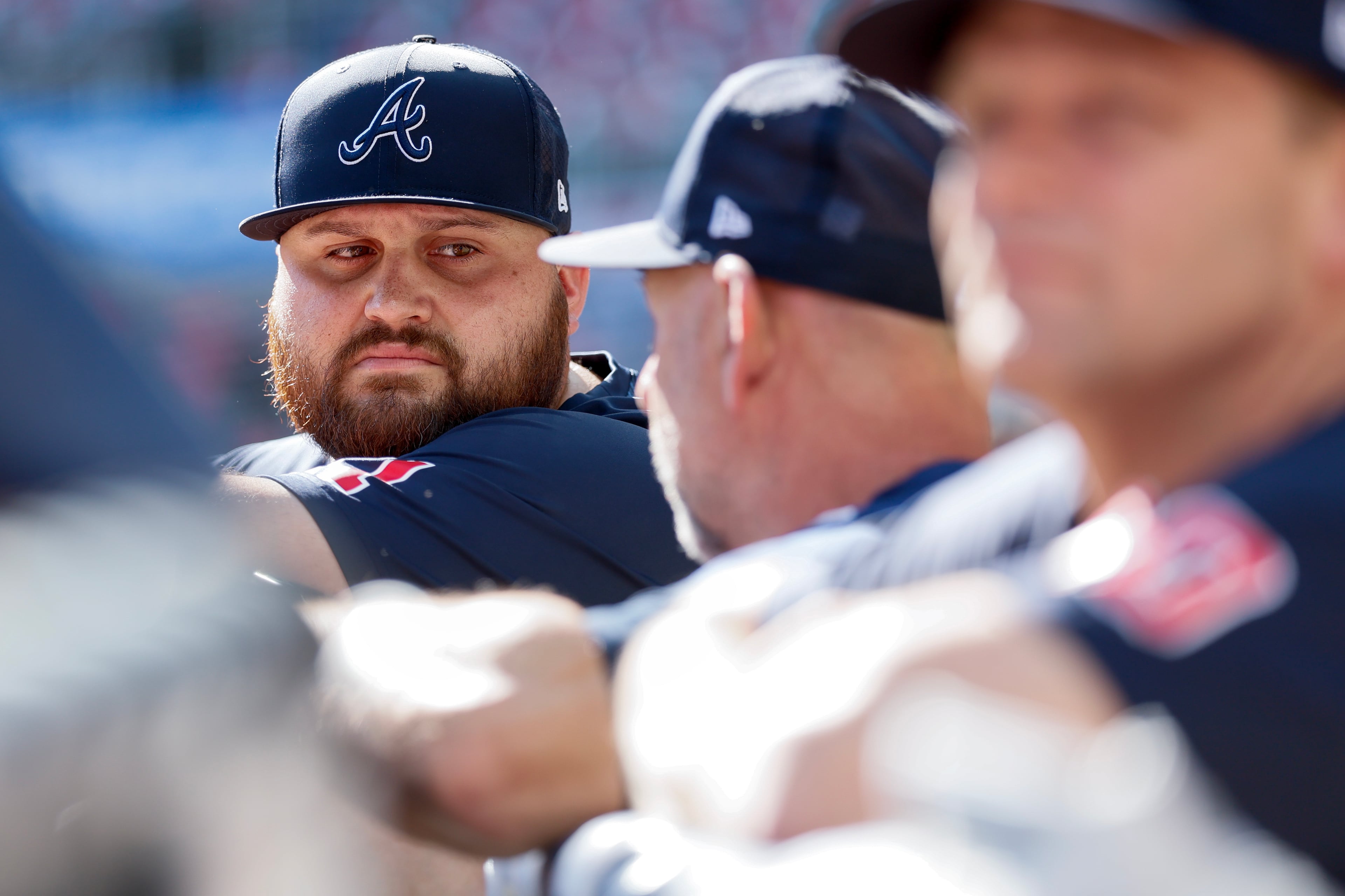 Atlanta Braves' Rowdy Tellez, left, listens to manager Walt Weiss, center, during batting practice before Game 4 of the MLB National League Division Series between the Atlanta Braves and the Los Angeles Dodgers, Wednesday, Oct. 7, 2026, in Atlanta. (Miguel Martinez/AJC)