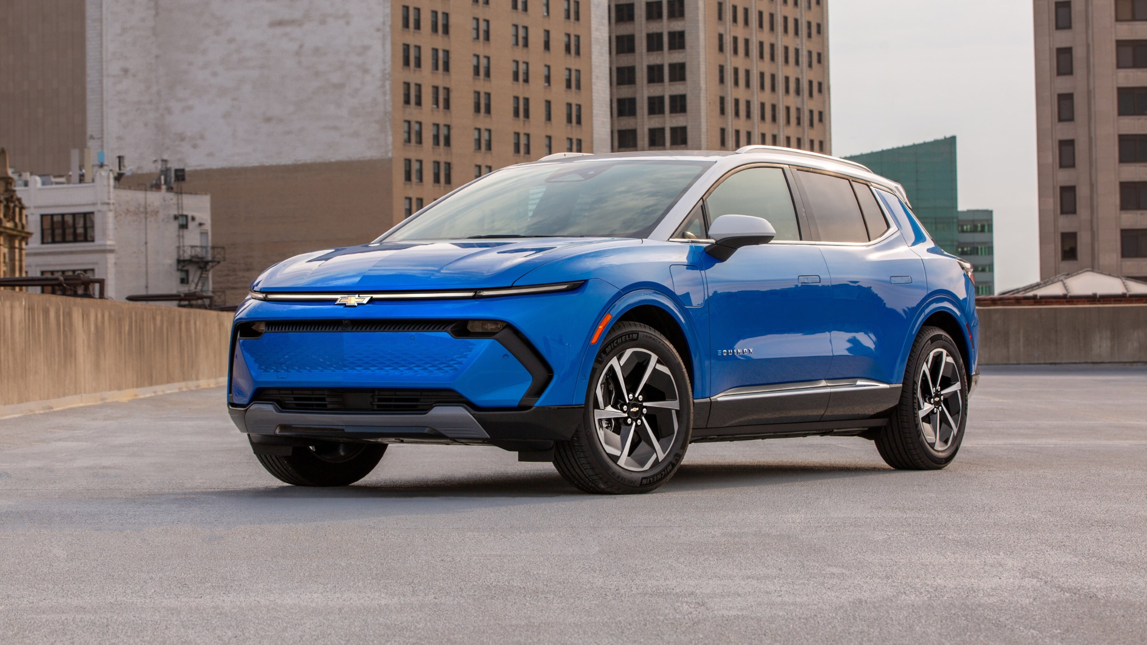 This photo provided by Chevrolet shows the 2024 Equinox EV, a small yet surprisingly roomy electric SUV that offers up to 319 miles of range. As a used EV, it can be a compelling value. (Courtesy of General Motors via AP)
