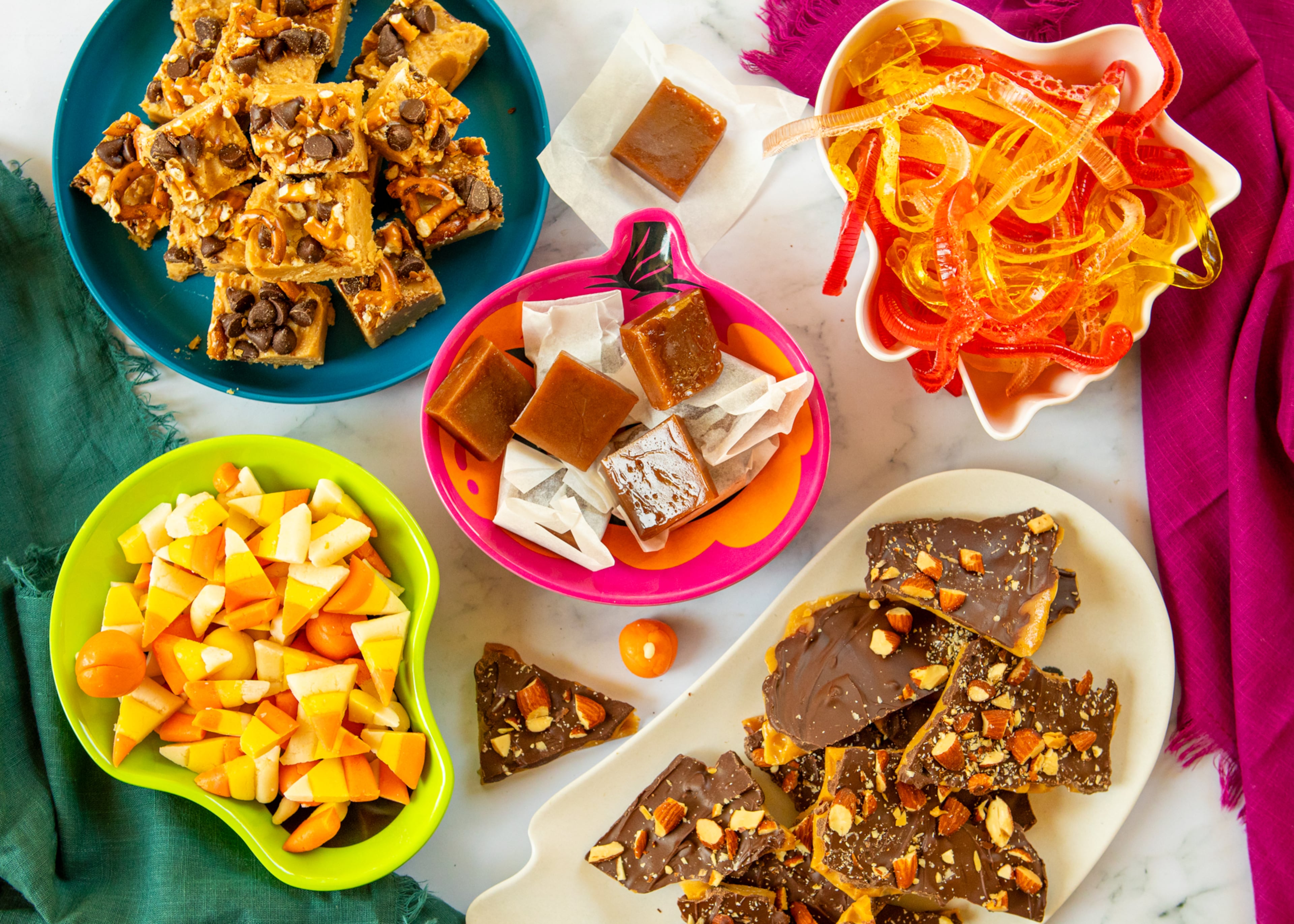 From top left, clockwise: Nut butter fudge, salted caramels, gummy worms, toffee and candy corn.